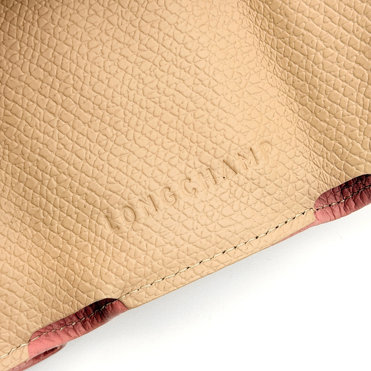 Longchamp Le Roseau compact wallet in pink grained leather with signature silver bamboo clasp.