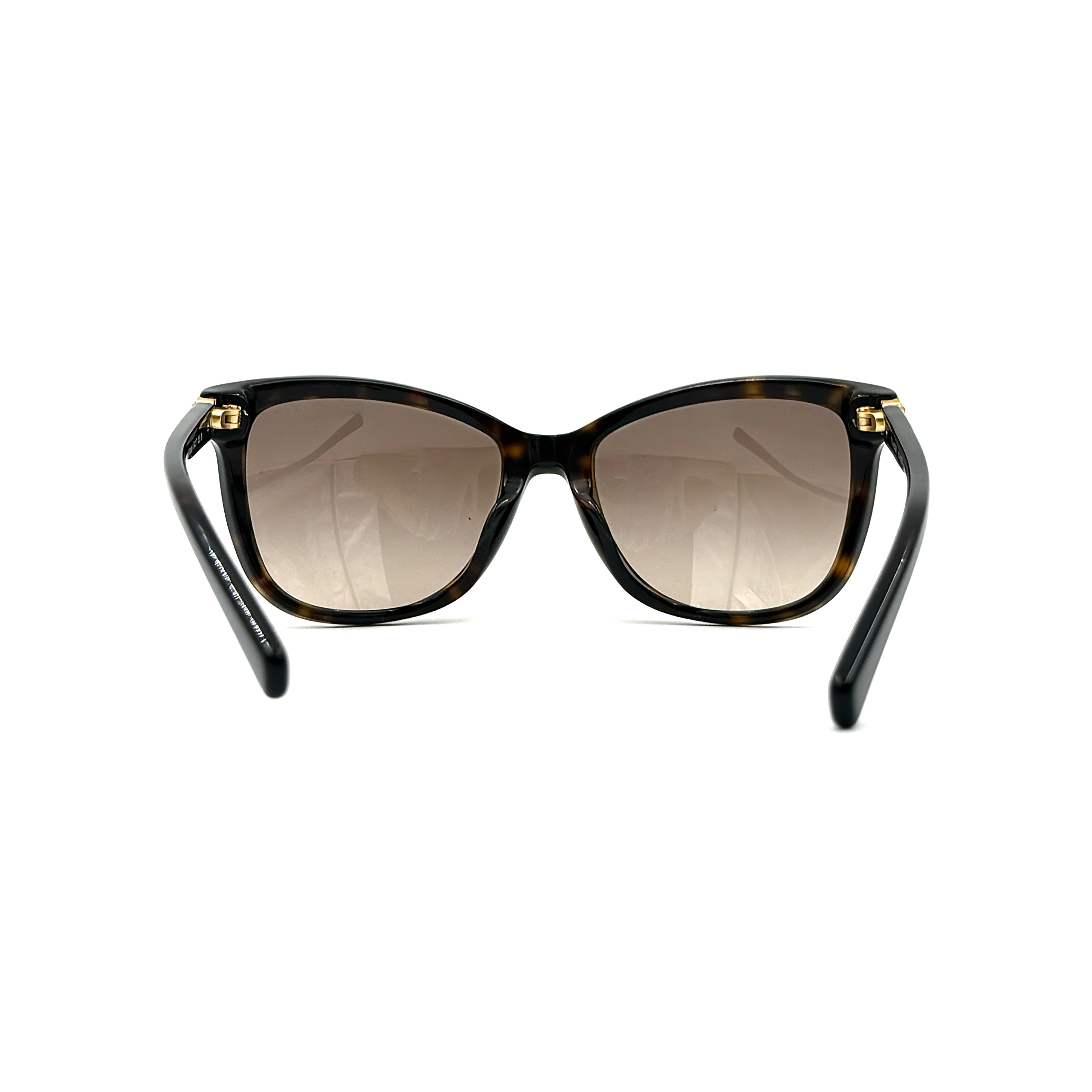 Coach HC8187BF sunglasses in dark tortoise acetate with gold floral and crystal temple detailing, shown in a three-quarter profile.