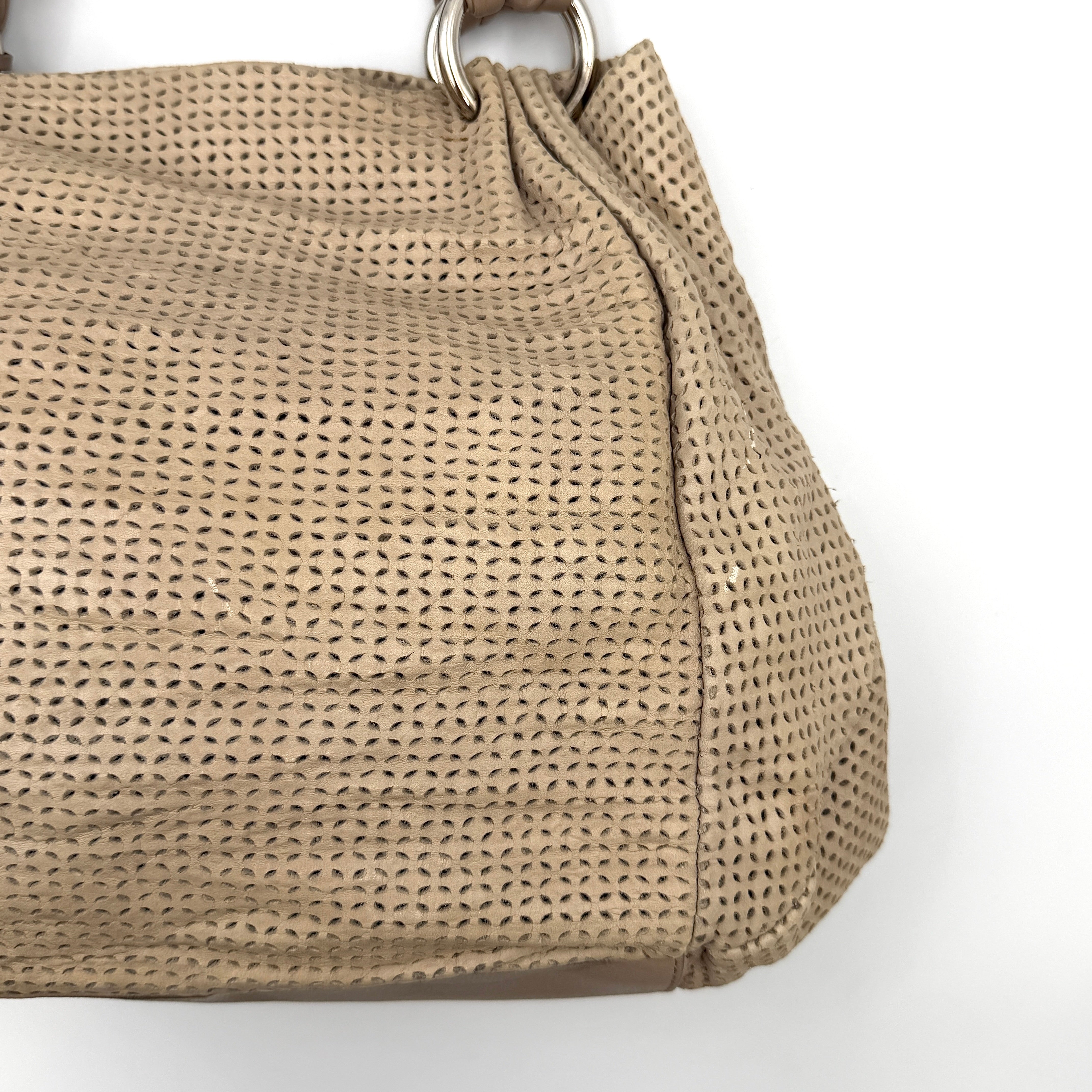 Furla light brown python-embossed hobo bag with perforated leather, silver hardware, and double handles.