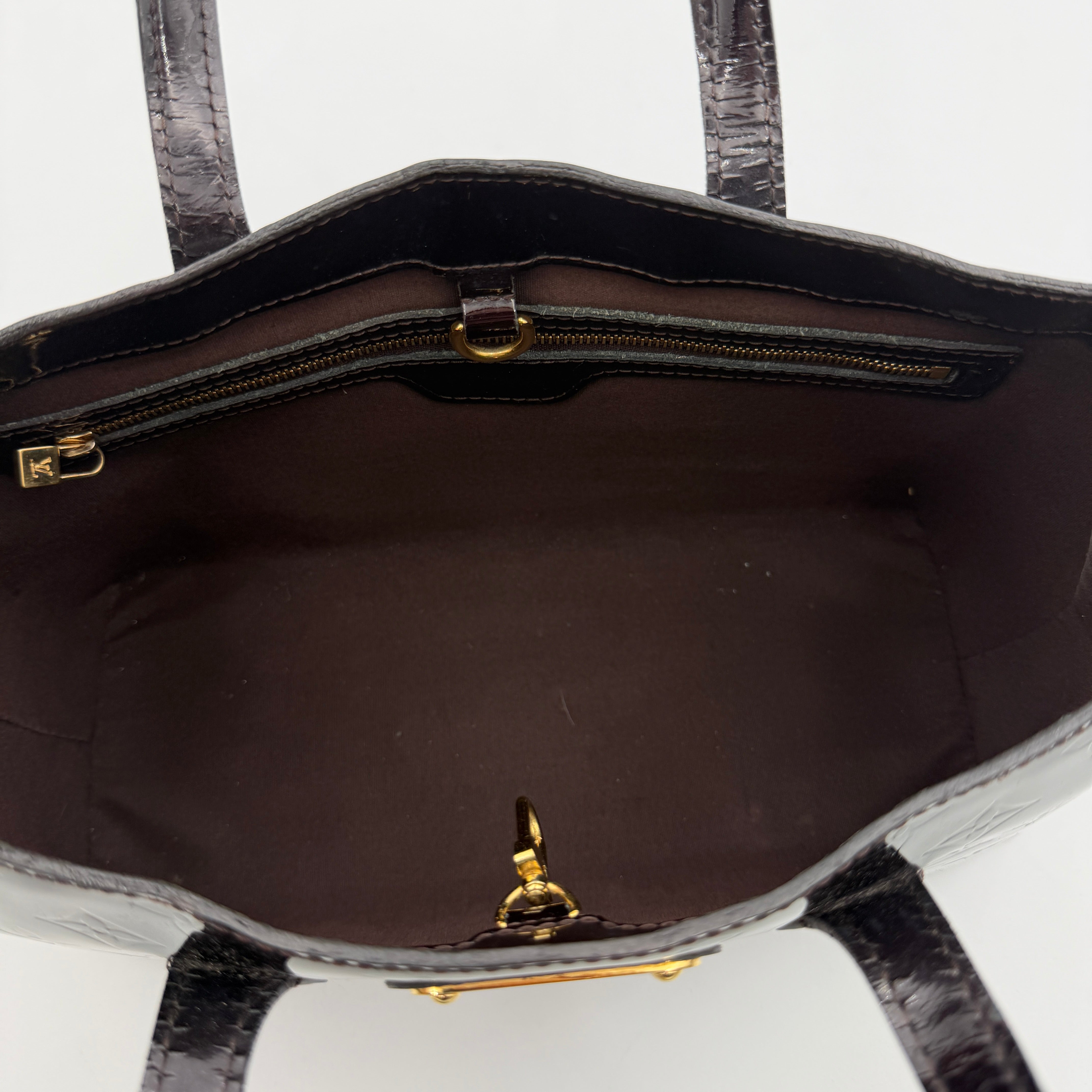 Louis Vuitton Monogram Rosewood Avenue Vernis Shoulder Bag in dark purple Vernis leather with gold-tone hardware, shown upright against a neutral backdrop.