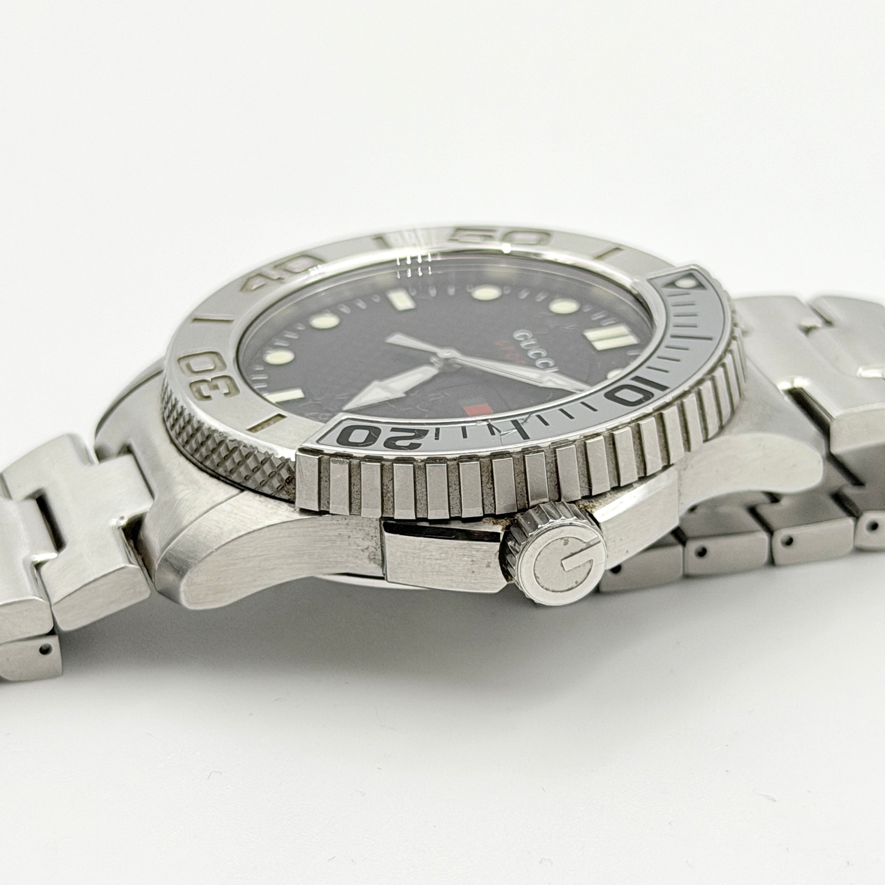Gucci G-Timeless Sport Watch in silver with black dial, presented in its original box with booklet and extra links.