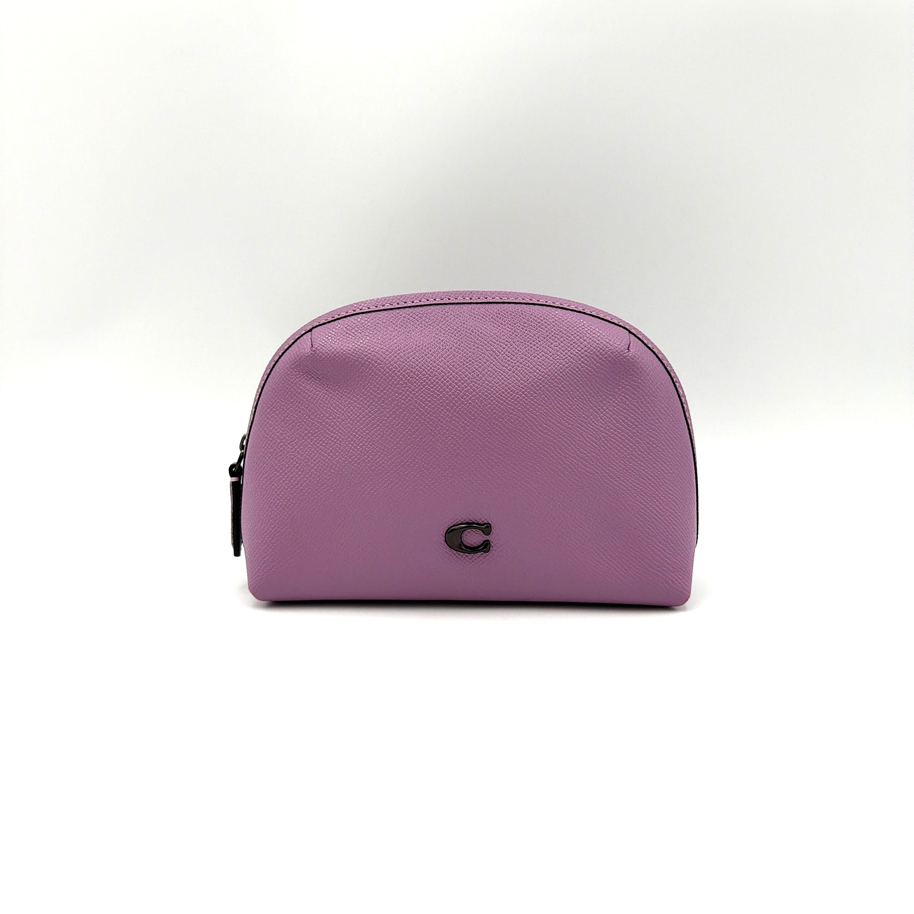 Coach Julienne Cosmetic Case 17 in purple grained leather with black hardware, photographed on a plain background.