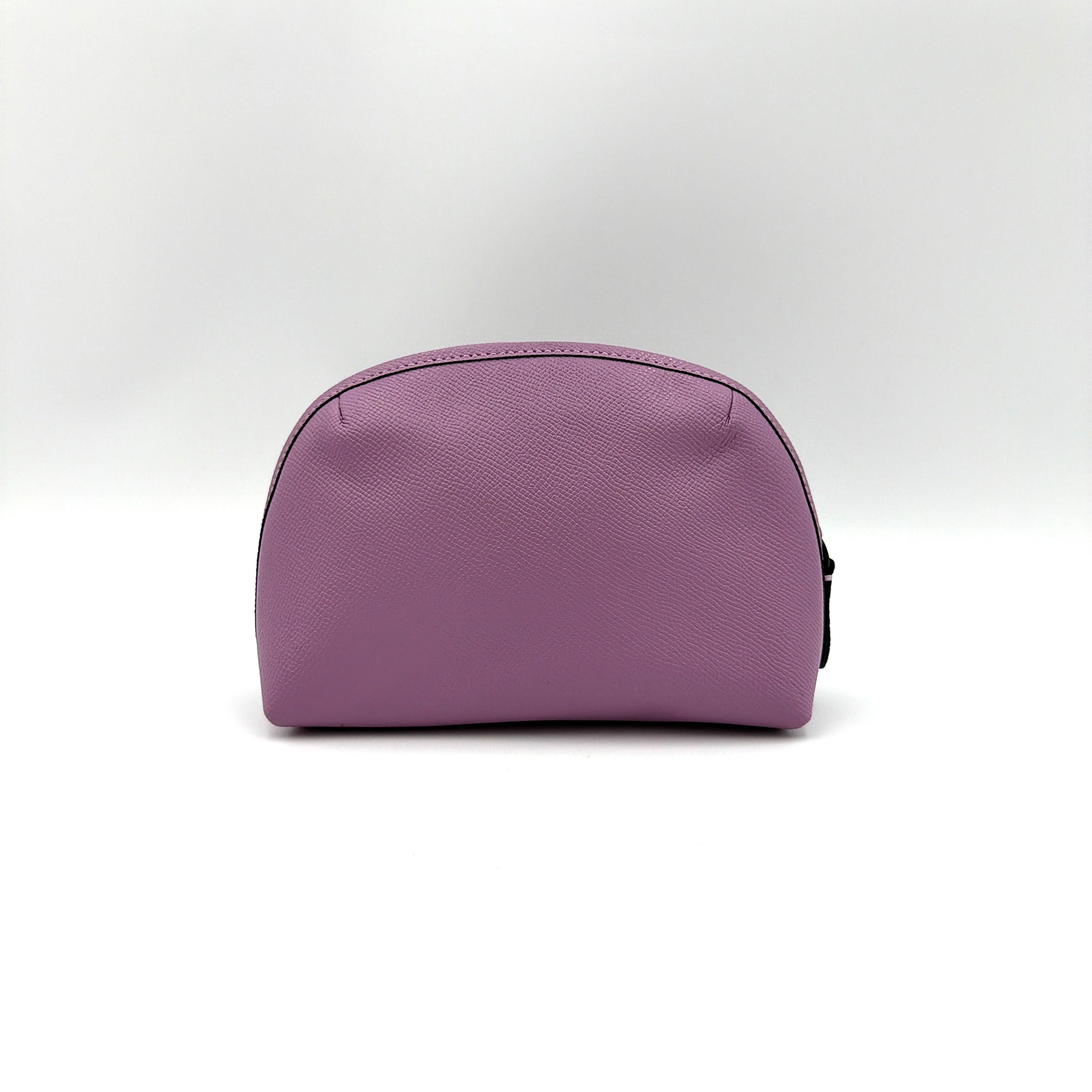 Coach Julienne Cosmetic Case 17 in purple grained leather with black hardware, photographed on a plain background.