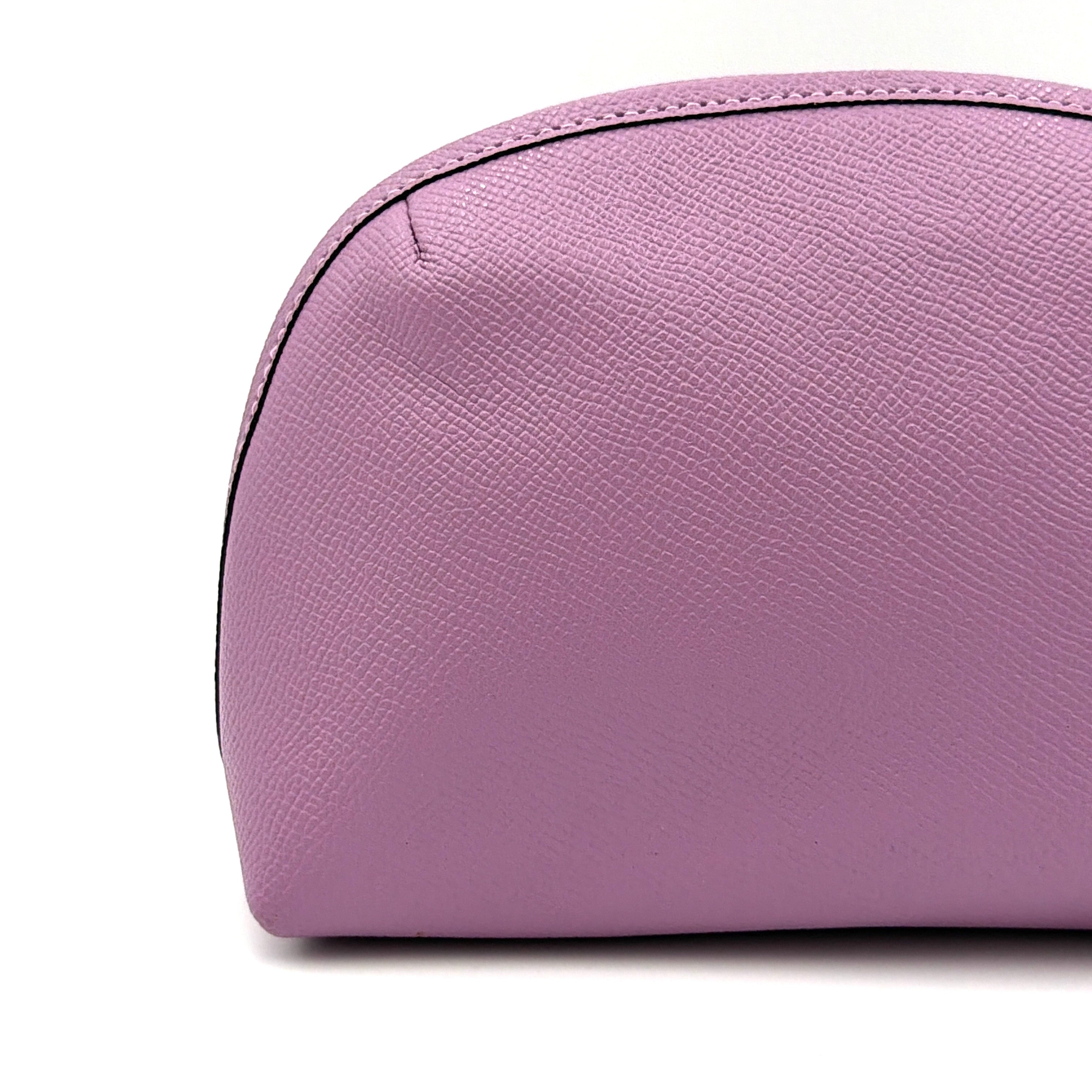 Coach Julienne Cosmetic Case 17 in purple grained leather with black hardware, photographed on a plain background.