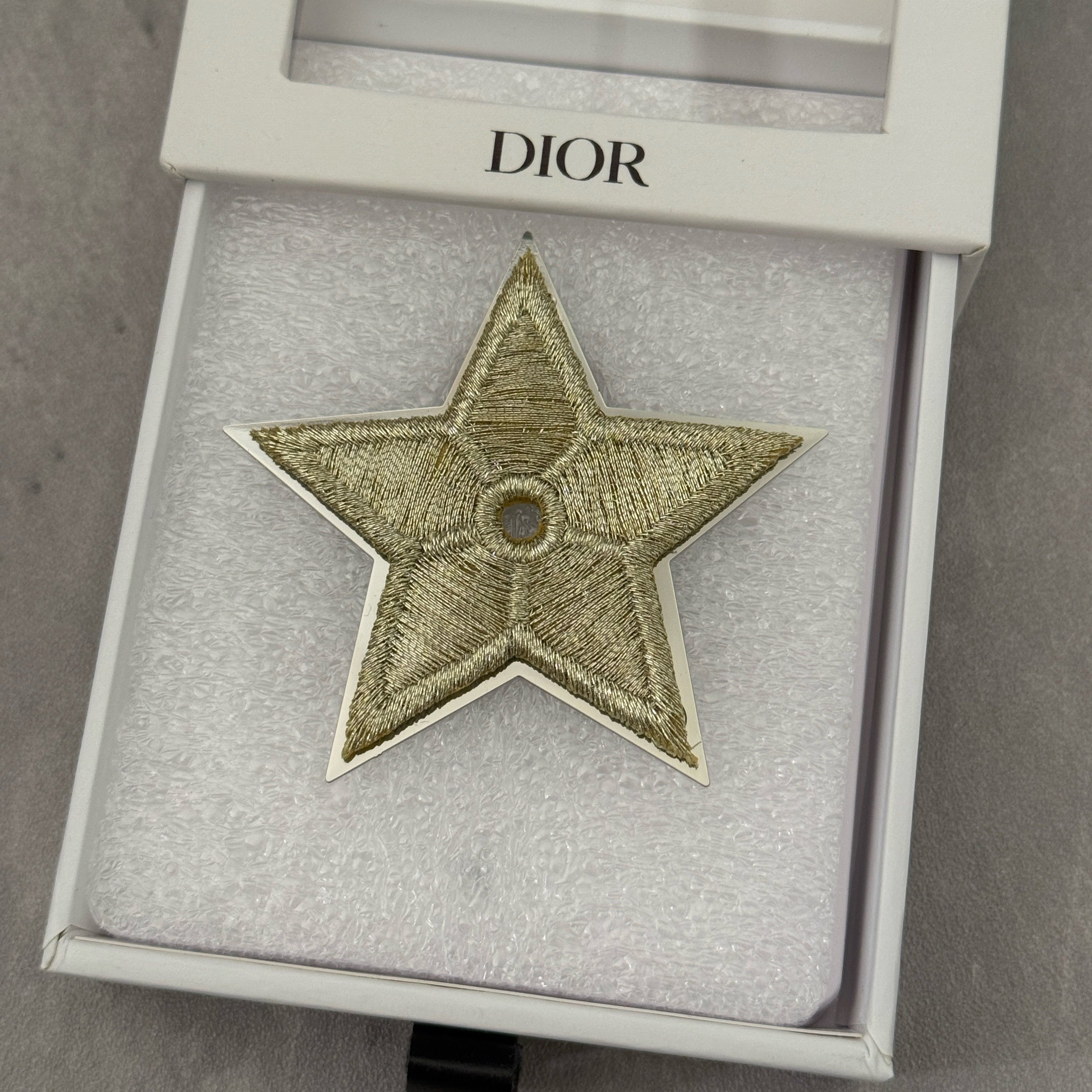 Dior Vintage Star Pin with embroidered gold-tone detailing, silver-tone backing, and original Dior Beauté engraving.