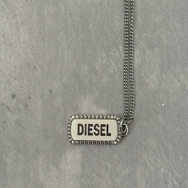 Diesel Signature Stainless Steel Dog Tag Necklace with a studded border and logo engraving on a silver-tone chain.