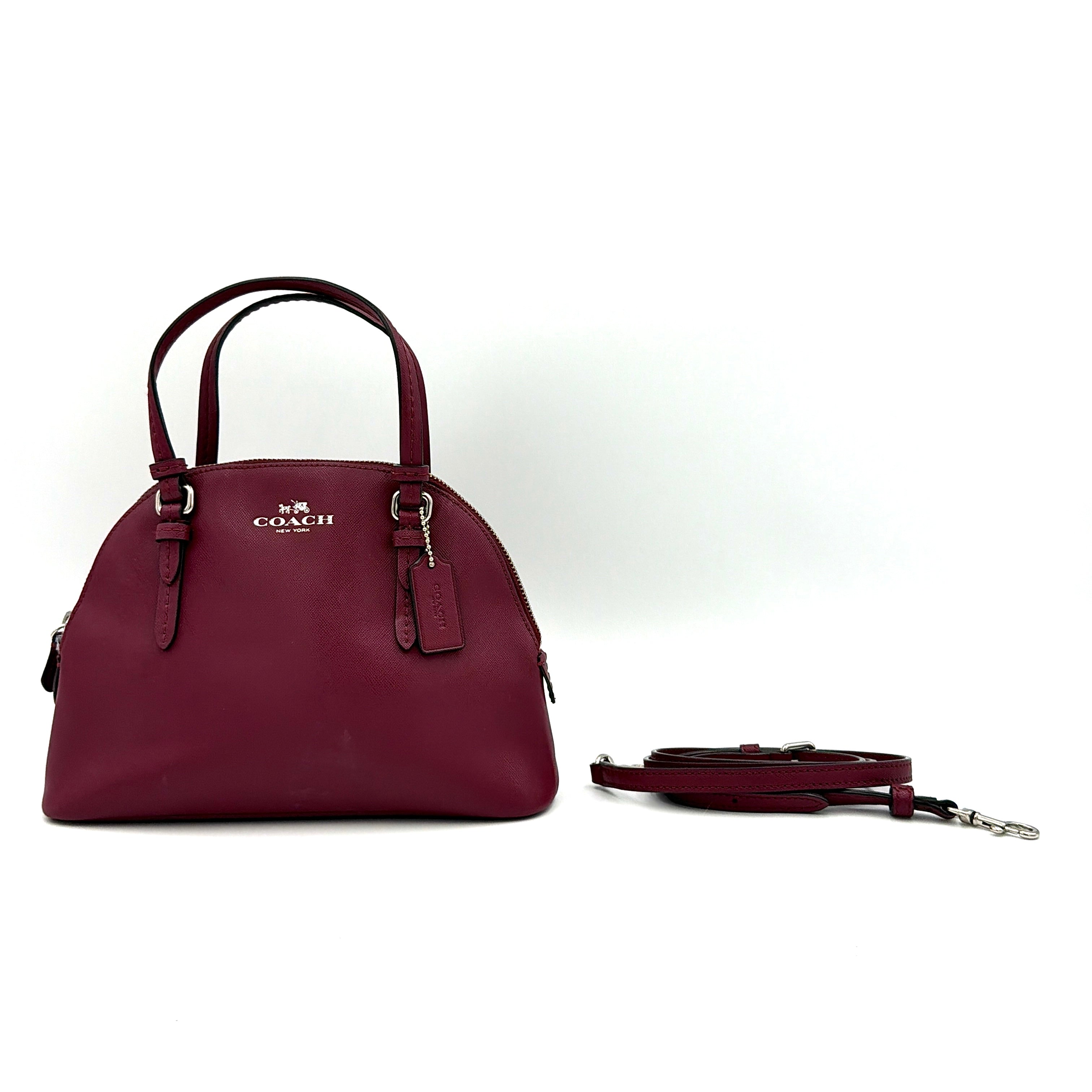Coach Peyton satchel in burgundy crossgrain leather with silver hardware, shown with its detachable shoulder strap.