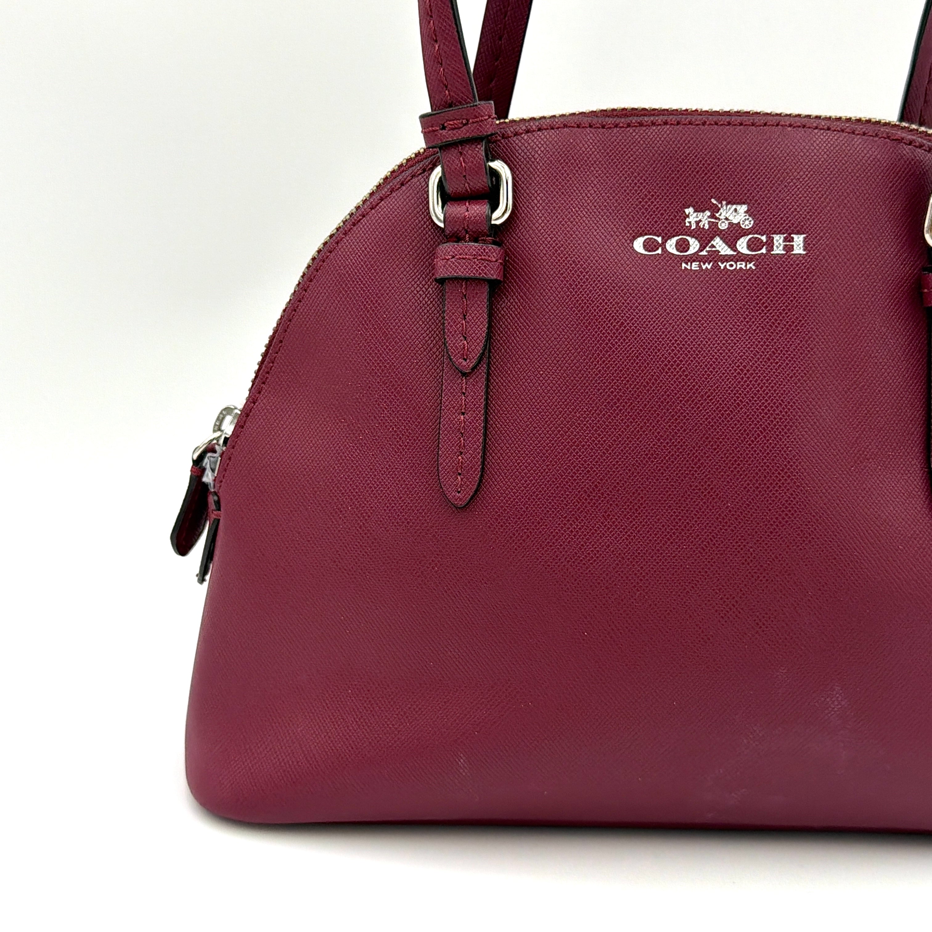 Coach Peyton satchel in burgundy crossgrain leather with silver hardware, shown with its detachable shoulder strap.