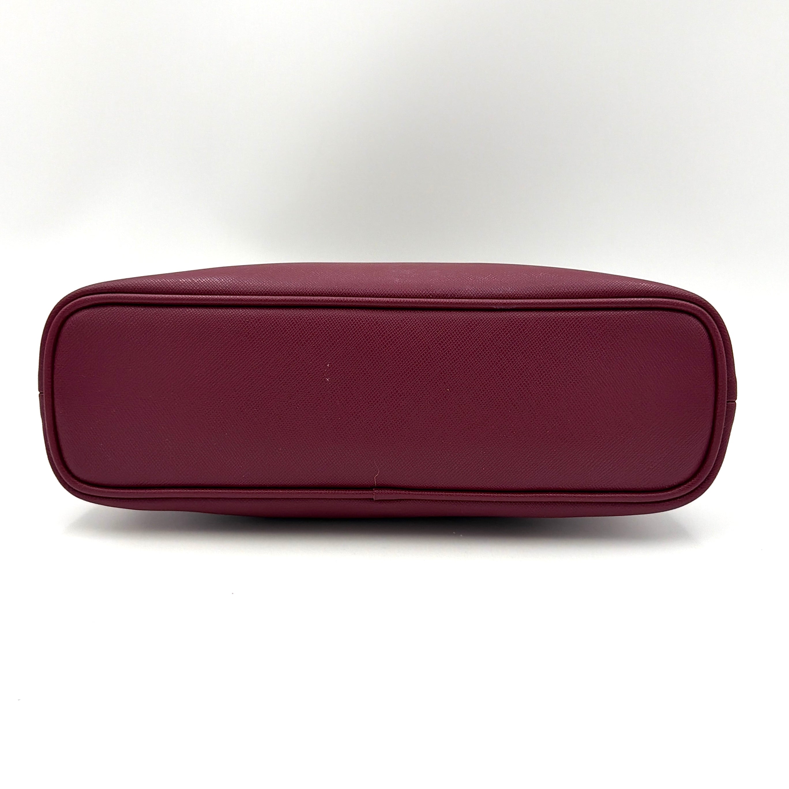 Coach Peyton satchel in burgundy crossgrain leather with silver hardware, shown with its detachable shoulder strap.