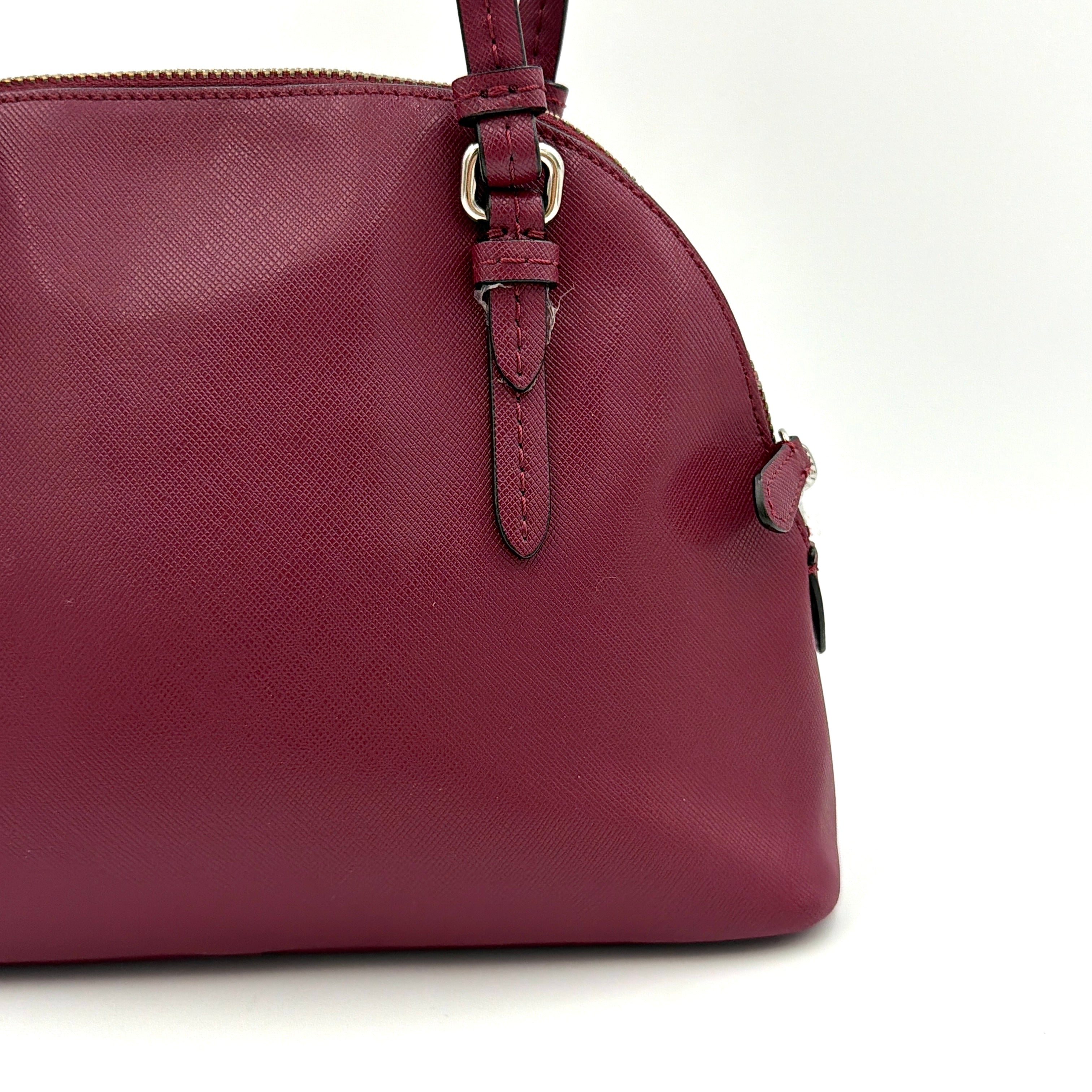 Coach Peyton satchel in burgundy crossgrain leather with silver hardware, shown with its detachable shoulder strap.