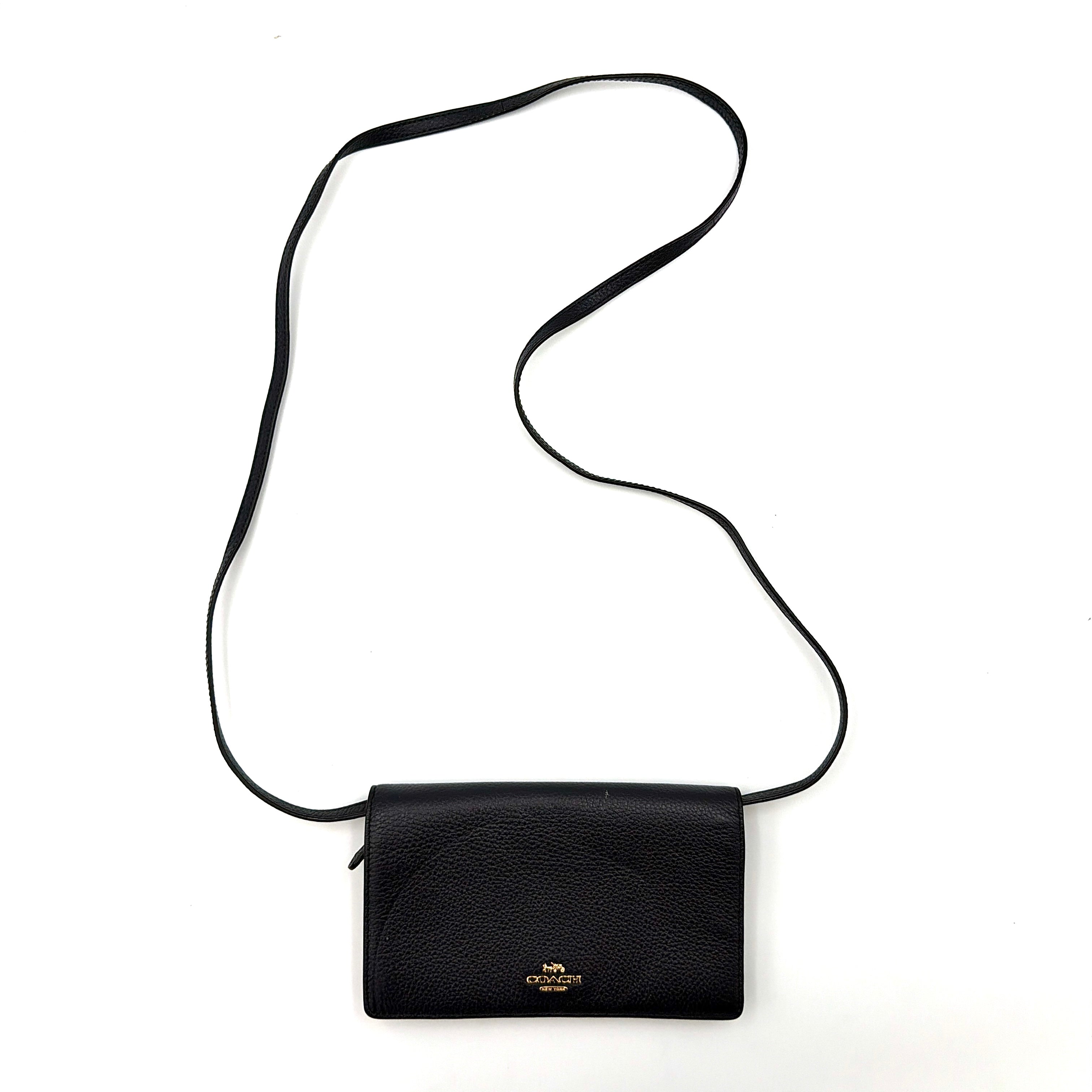 Coach Anna Foldover Clutch Crossbody Bag in navy pebbled leather with slim strap and gold logo detailing.