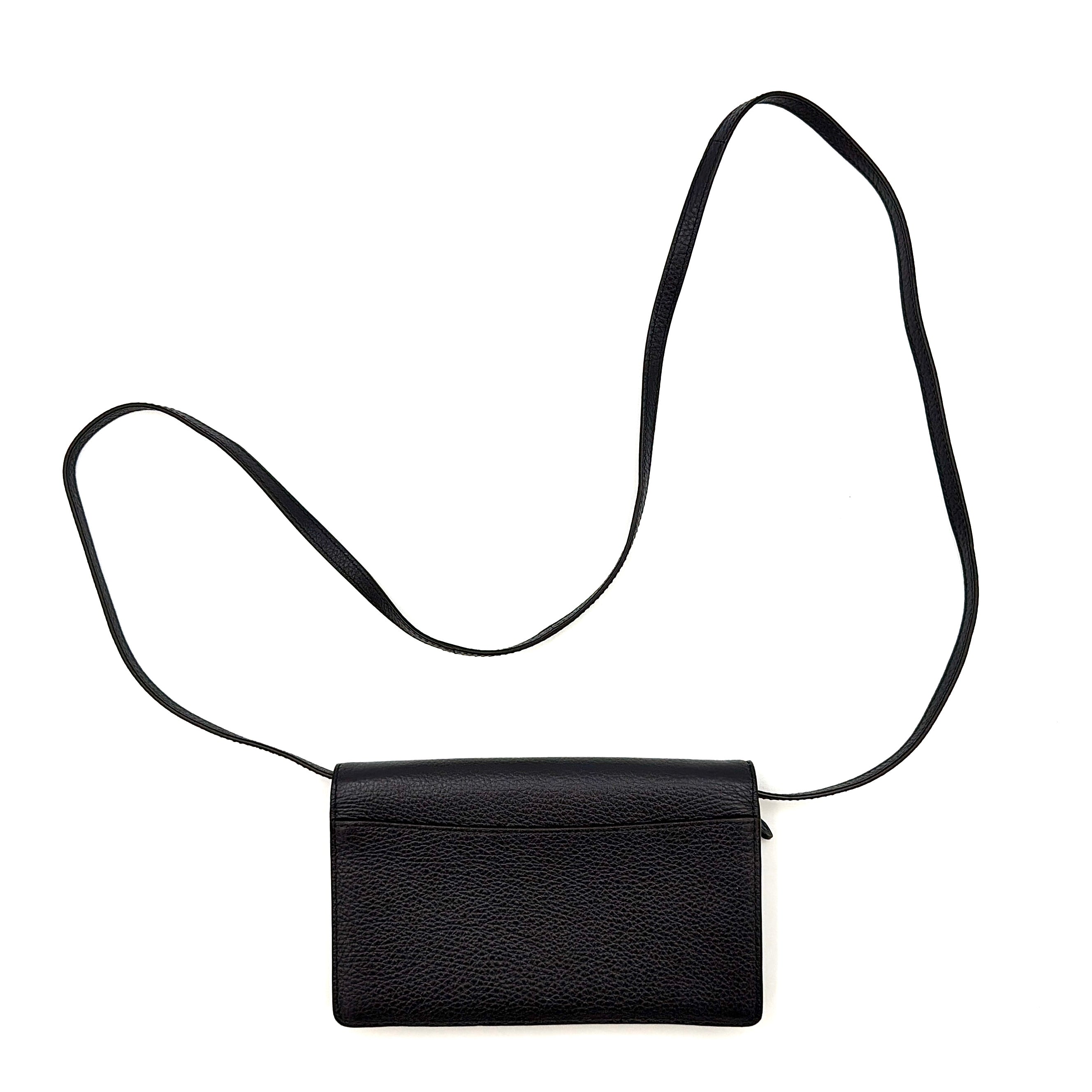 Coach Anna Foldover Clutch Crossbody Bag in navy pebbled leather with slim strap and gold logo detailing.