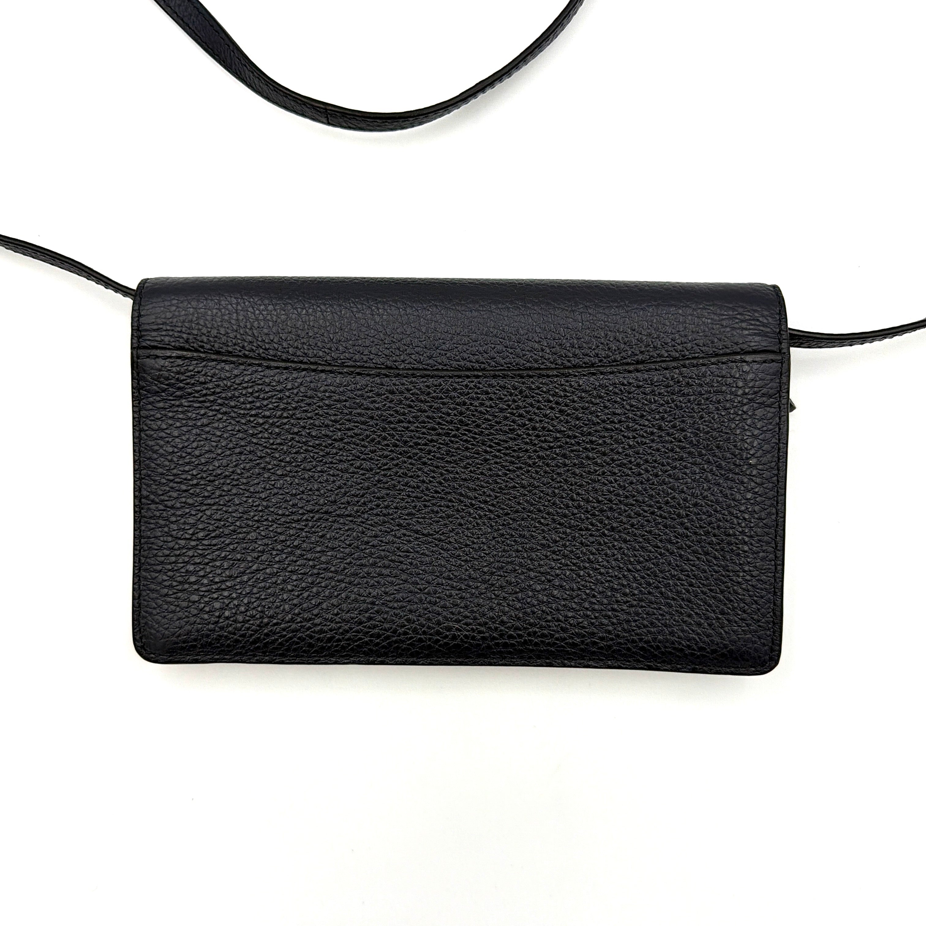 Coach Anna Foldover Clutch Crossbody Bag in navy pebbled leather with slim strap and gold logo detailing.