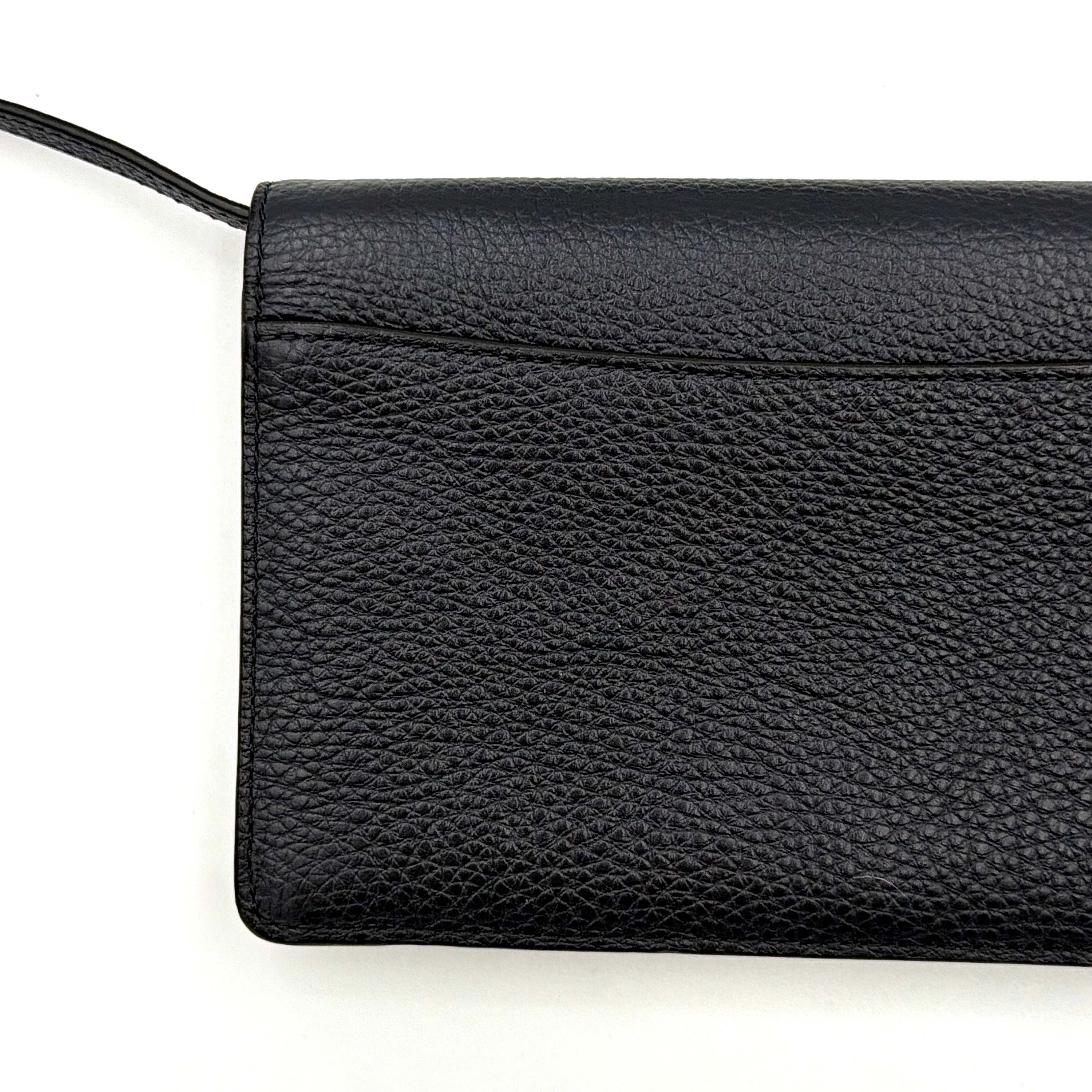 Coach Anna Foldover Clutch Crossbody Bag in navy pebbled leather with slim strap and gold logo detailing.