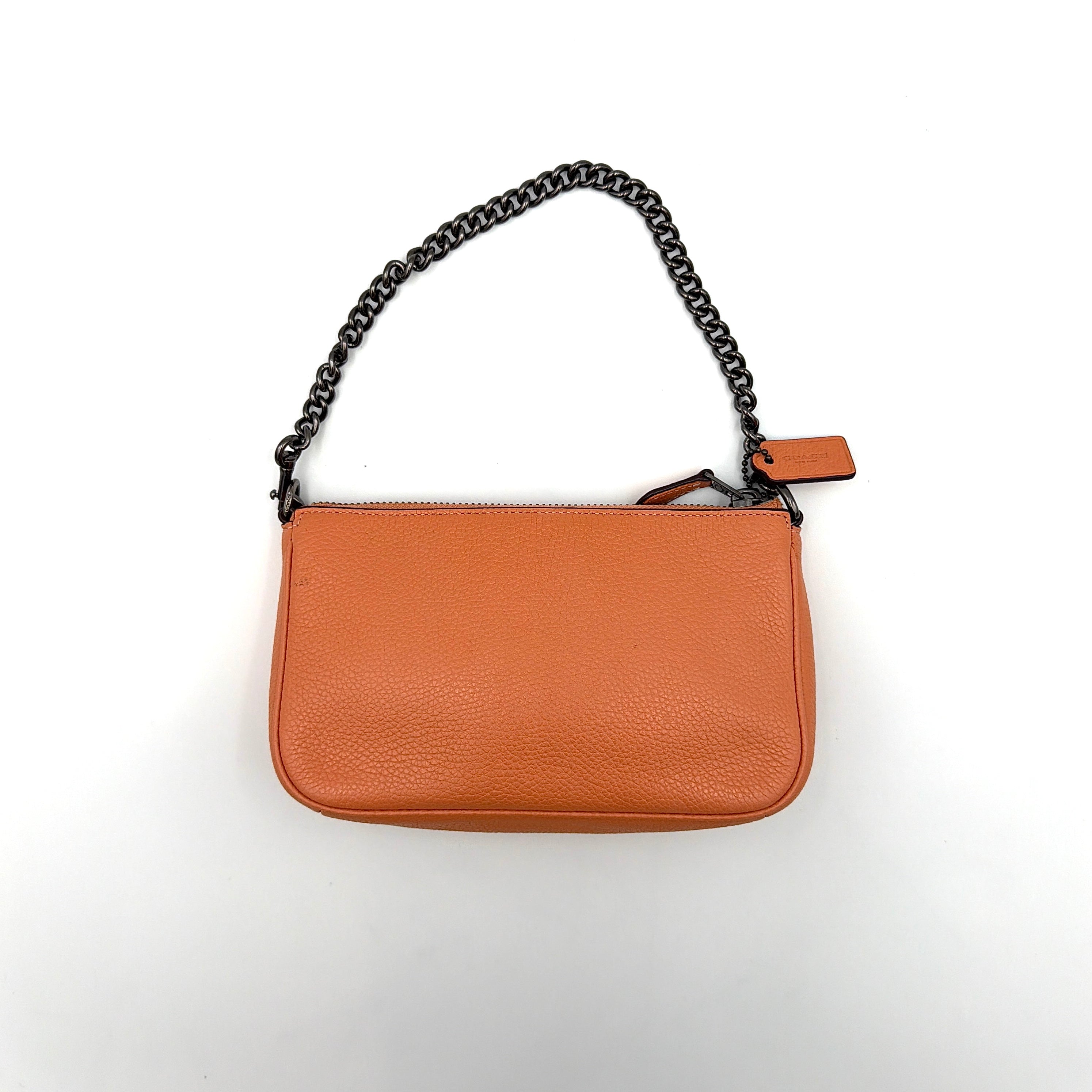 Coach Nolita 19 Prairie Rivets Shoulder Bag in bold orange pebbled leather with mixed metal rivet embellishments and chunky chain strap.
