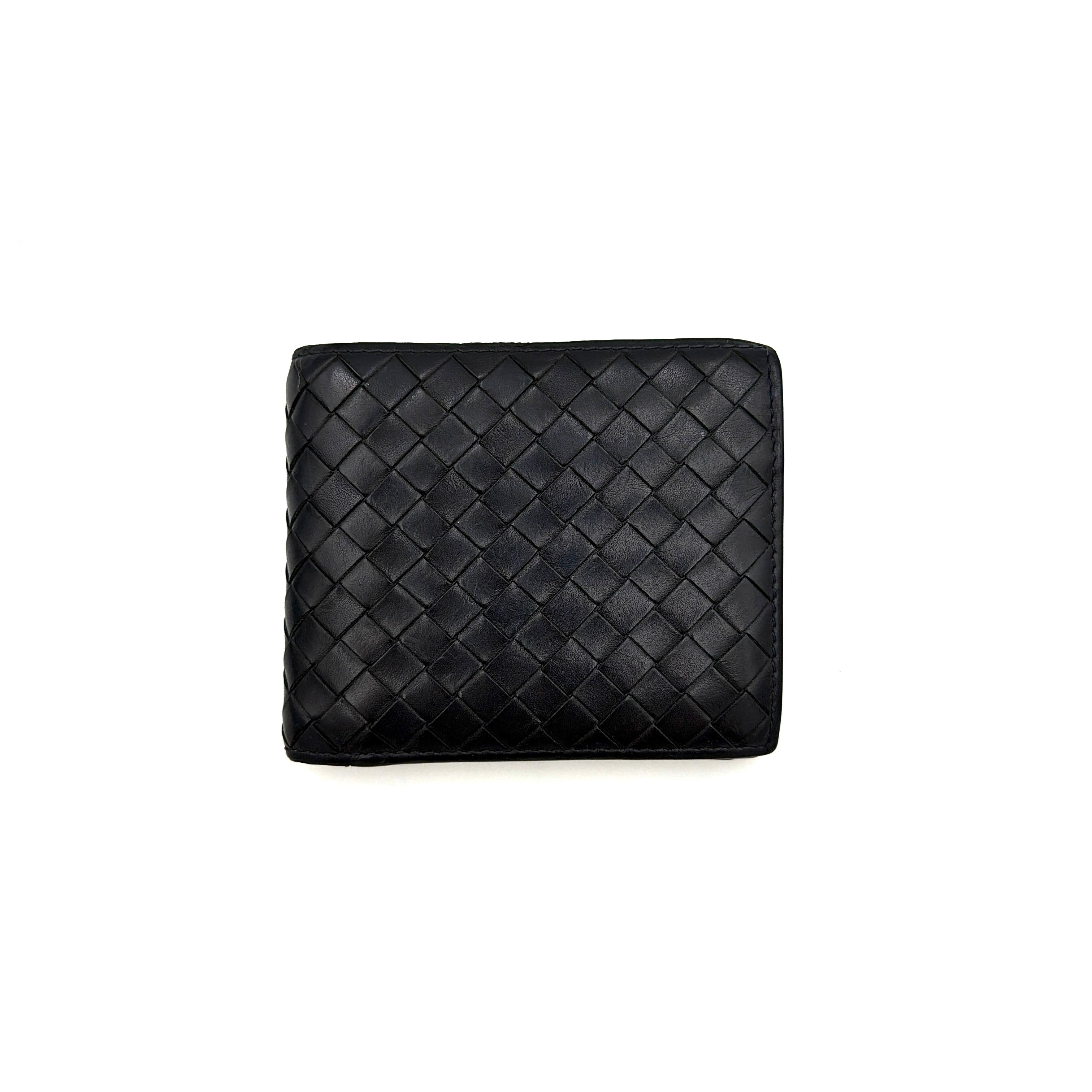 Black Bottega Veneta Intrecciato leather wallet with signature woven pattern photographed against a clean background.