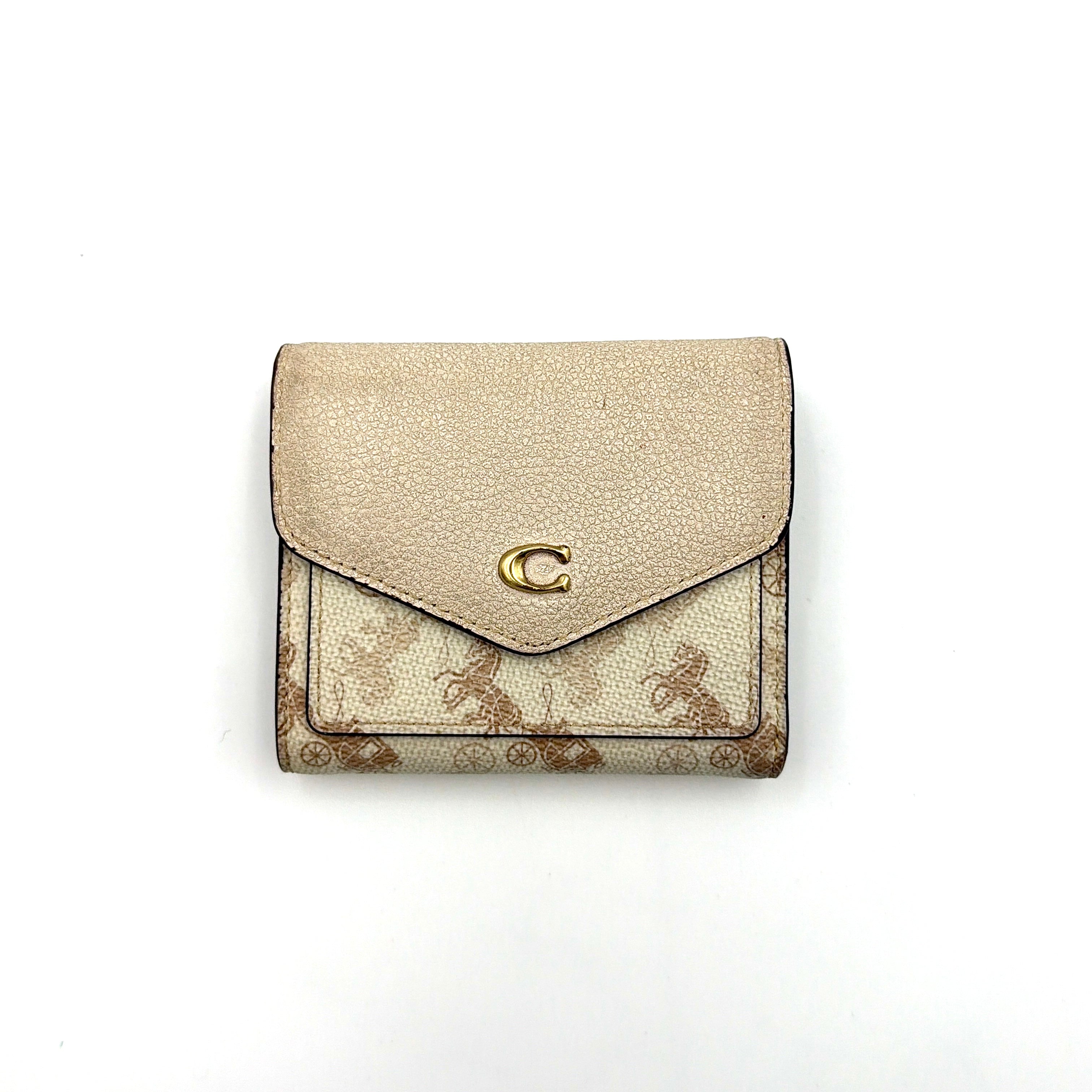 Coach Wyn Horse & Carriage Small Wallet in cream with gold hardware, featuring an envelope flap and iconic horse and carriage motif.