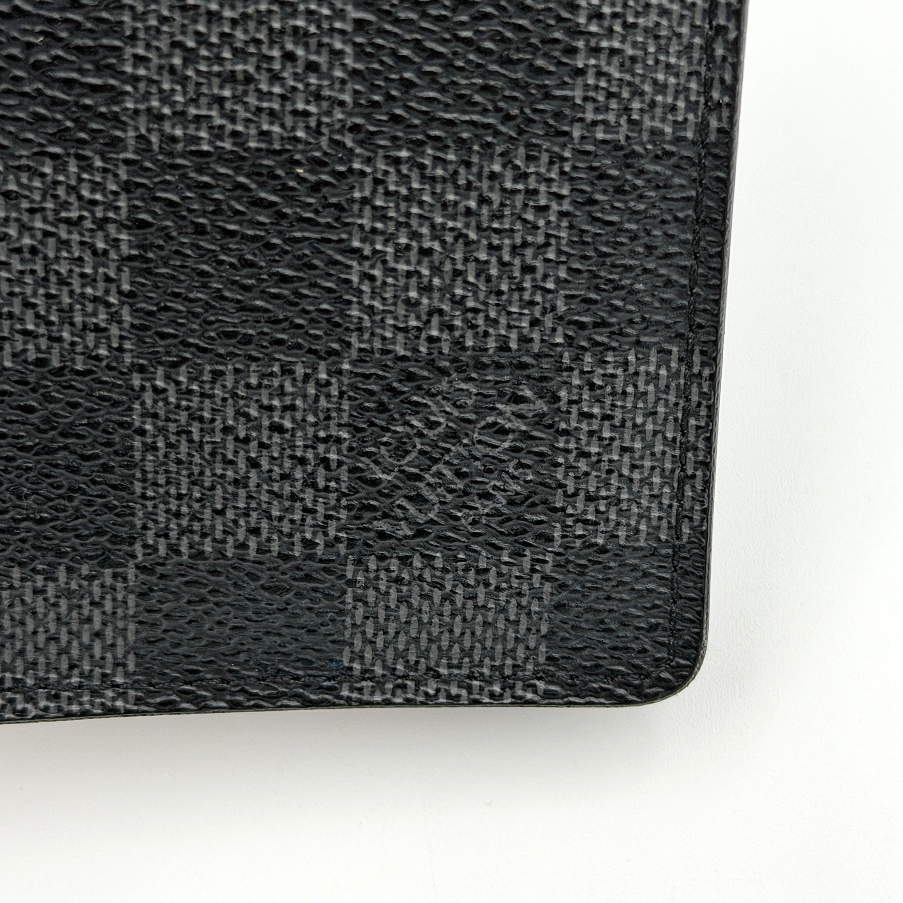 Louis Vuitton Damier Graphite Pocket Organizer in black coated canvas with tonal checkerboard pattern and slim profile.
