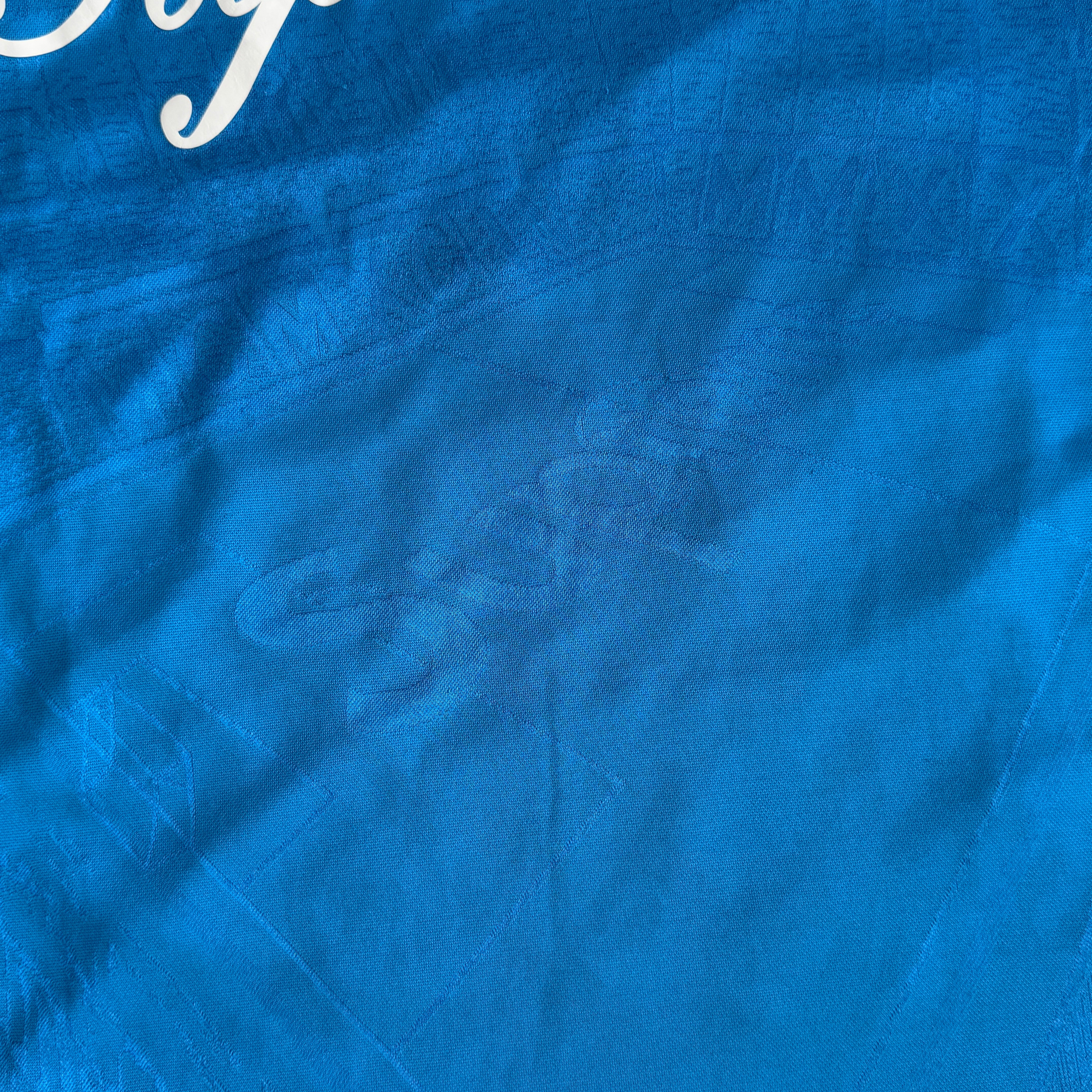 Supreme Jacquard Soccer Jersey in blue with front Supreme script and patch, navy side panels, and sporty detailing.