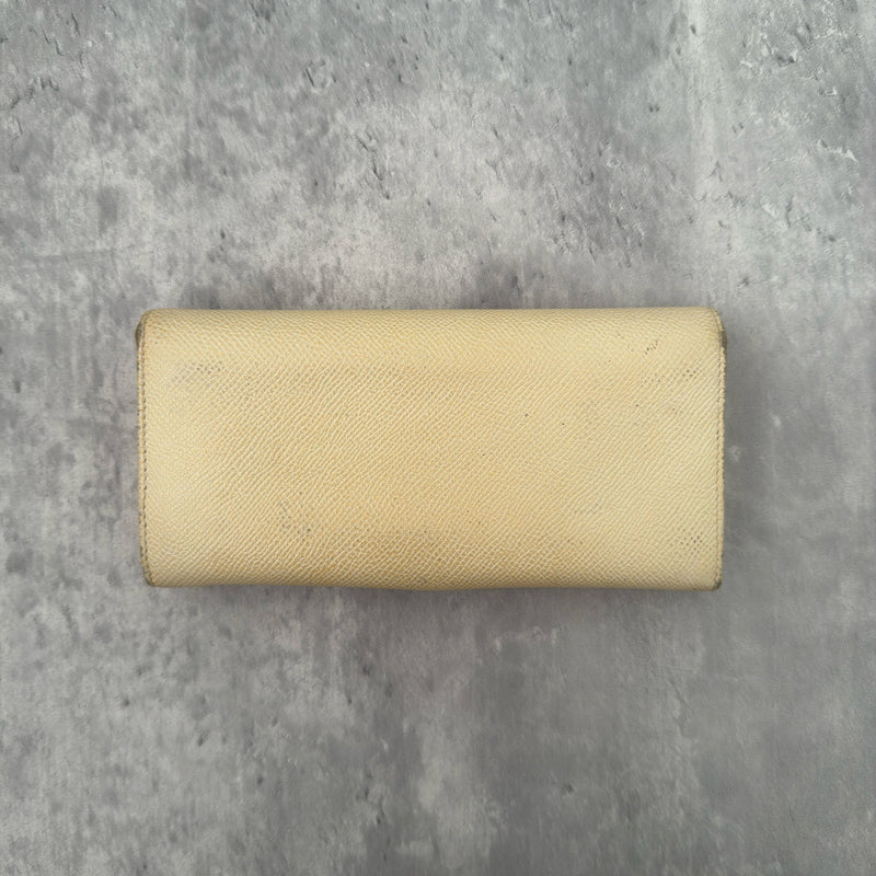 Bvlgari B.Zero1 Beige Saffiano Leather Long Wallet featuring a gold-tone ring clasp and fuchsia pink leather interior.