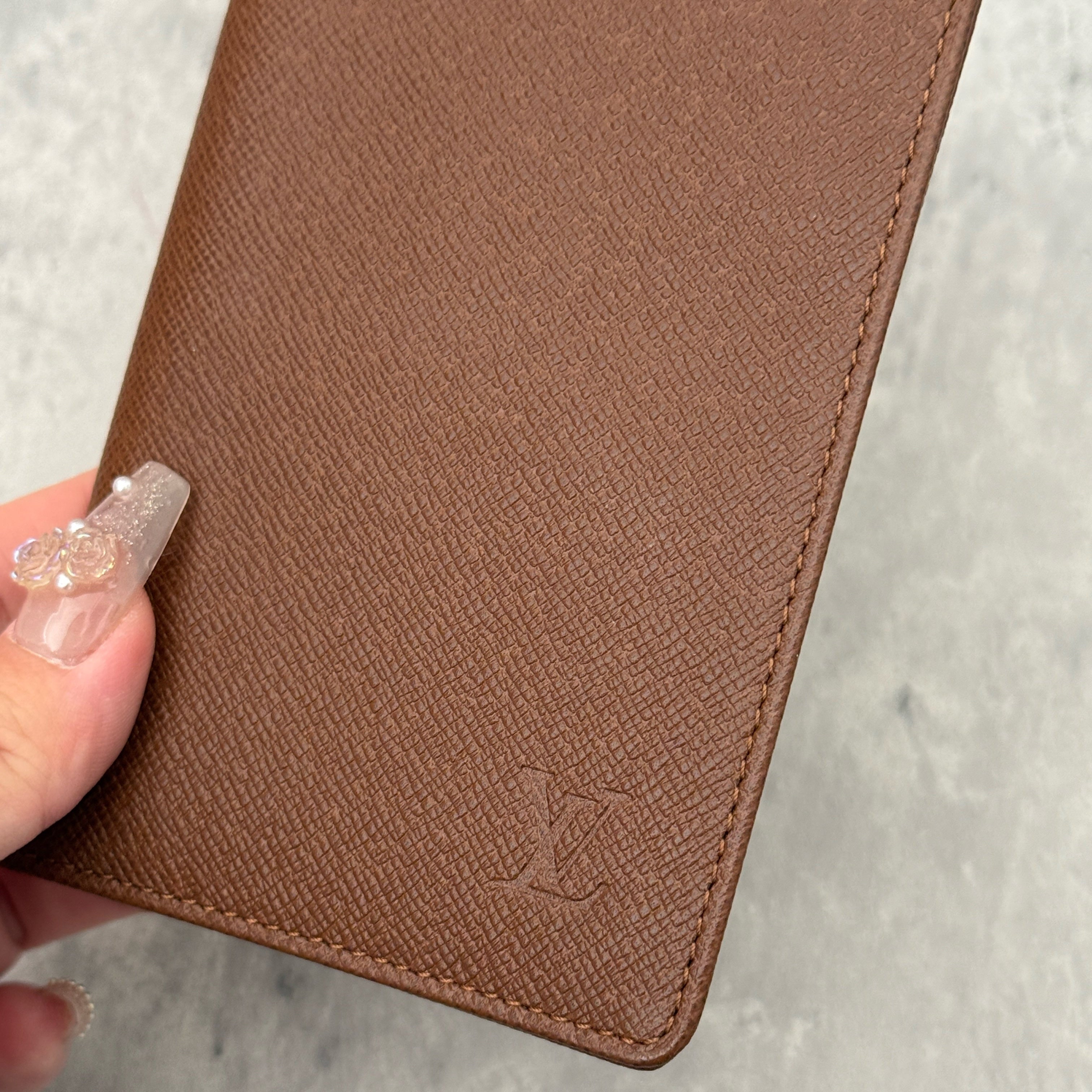 Louis Vuitton Vintage Brown Leather Cardholder with embossed LV logo and multiple card slots.