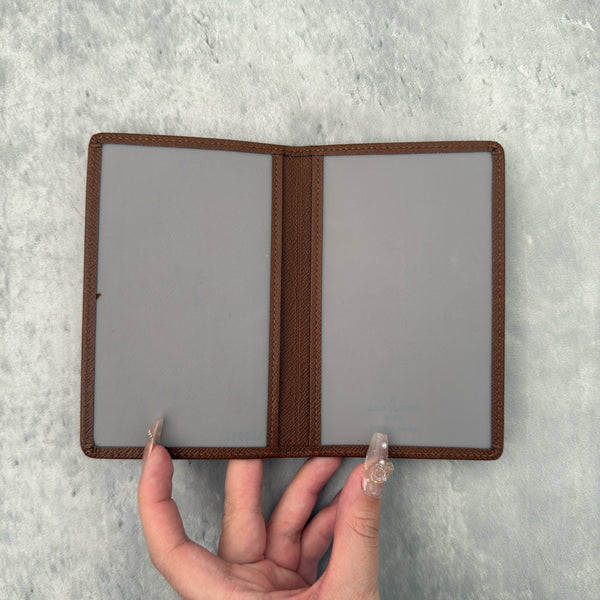 Louis Vuitton Vintage Brown Leather Cardholder with embossed LV logo and multiple card slots.