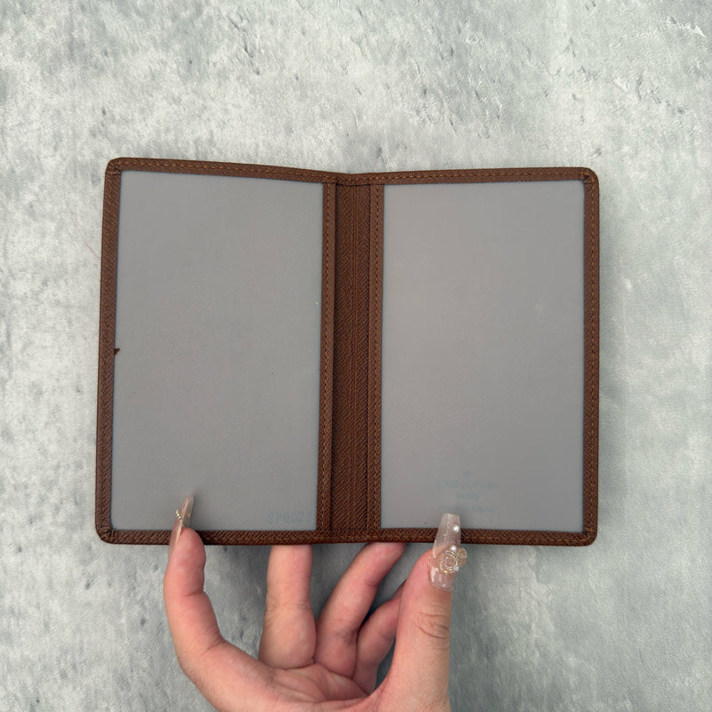 Louis Vuitton Vintage Brown Leather Cardholder with embossed LV logo and multiple card slots.