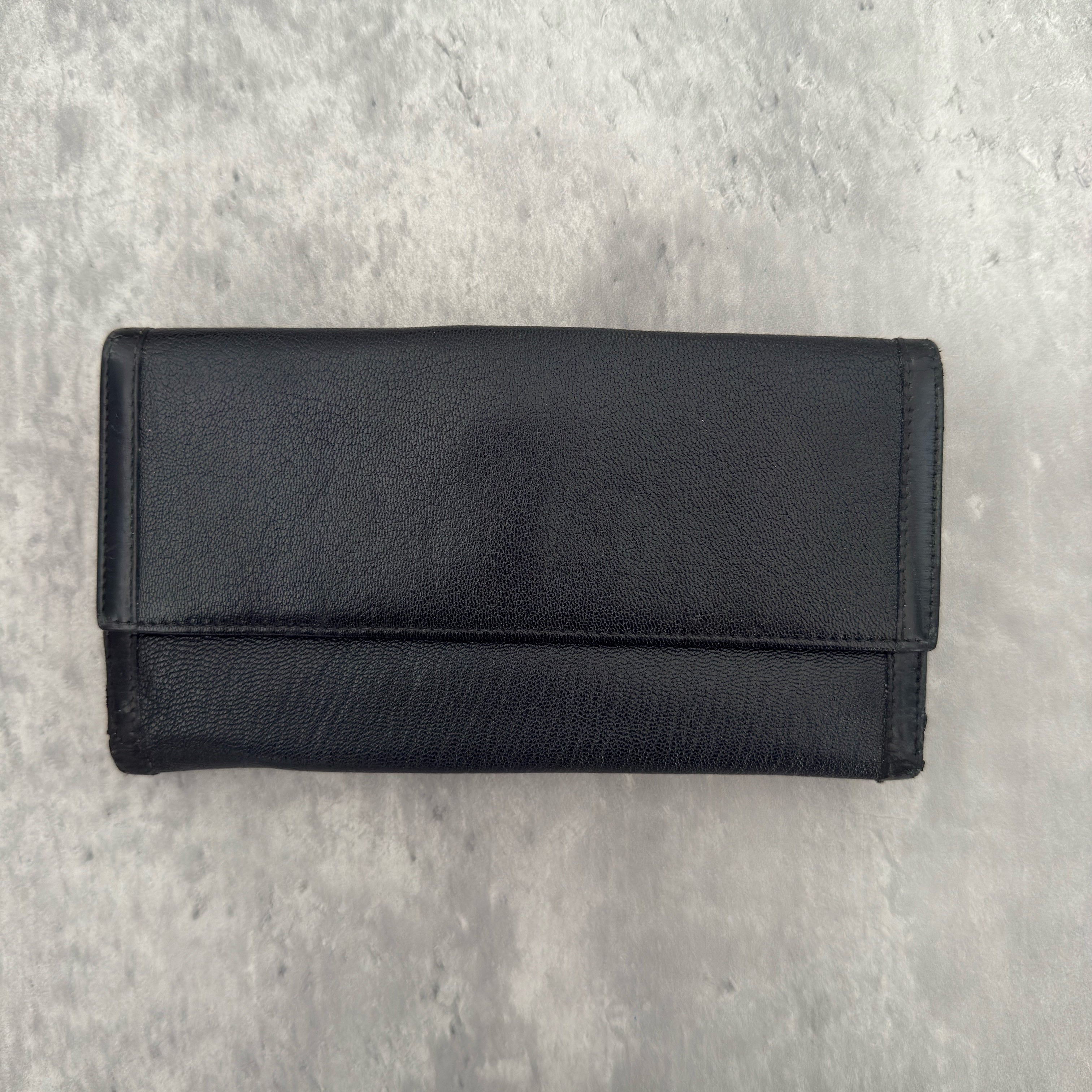 Bvlgari Doppio Tondo Bifold Long Wallet in black leather, featuring a silver-tone logo clasp, red fabric interior, and multiple compartments.