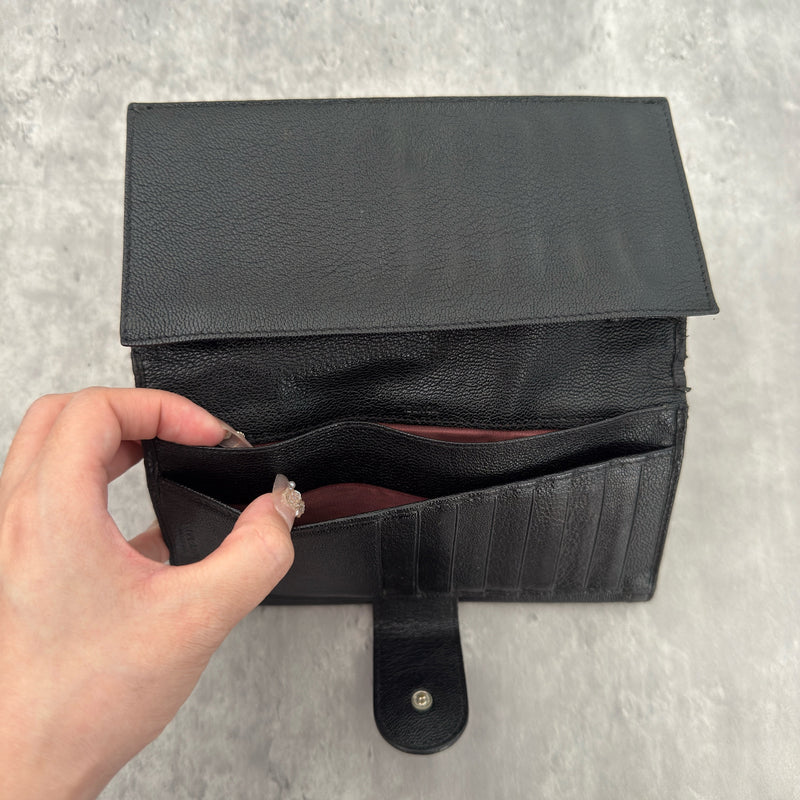 Bvlgari Doppio Tondo Bifold Long Wallet in black leather, featuring a silver-tone logo clasp, red fabric interior, and multiple compartments.
