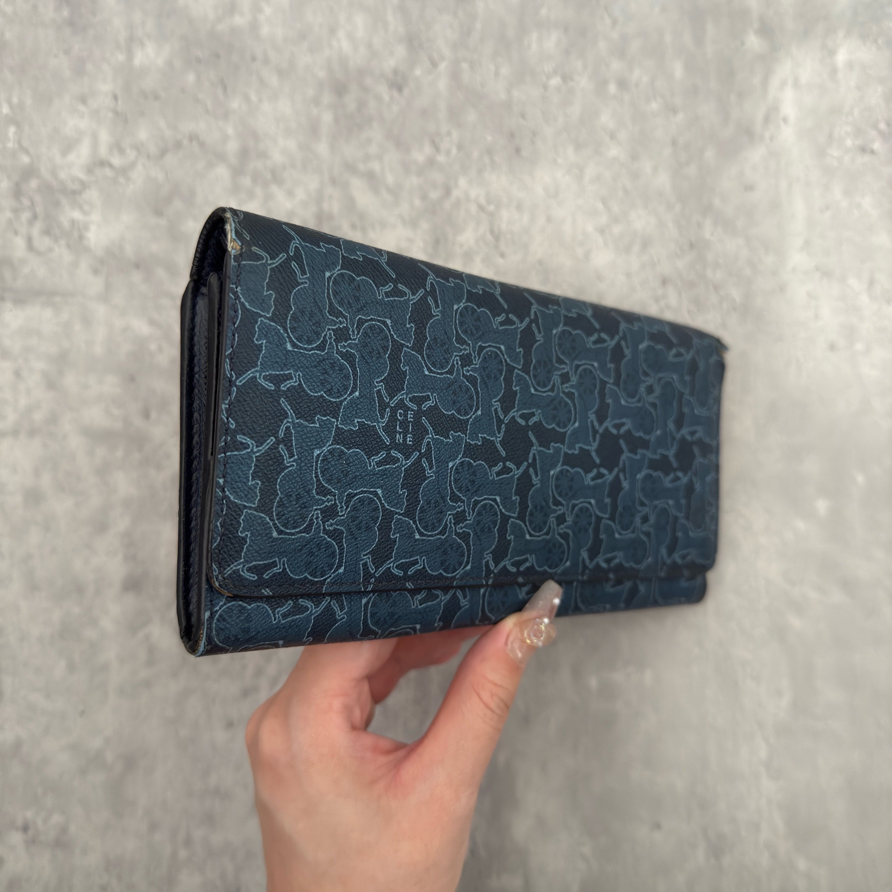Celine Macadam Carriage Navy Blue Long Wallet featuring signature carriage monogram canvas, blue leather interior, and multiple compartments for organization.