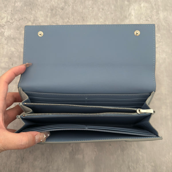 Celine Long Bifold Baby Blue Long Wallet, crafted from grained leather with a clipped button snap closure and spacious interior.