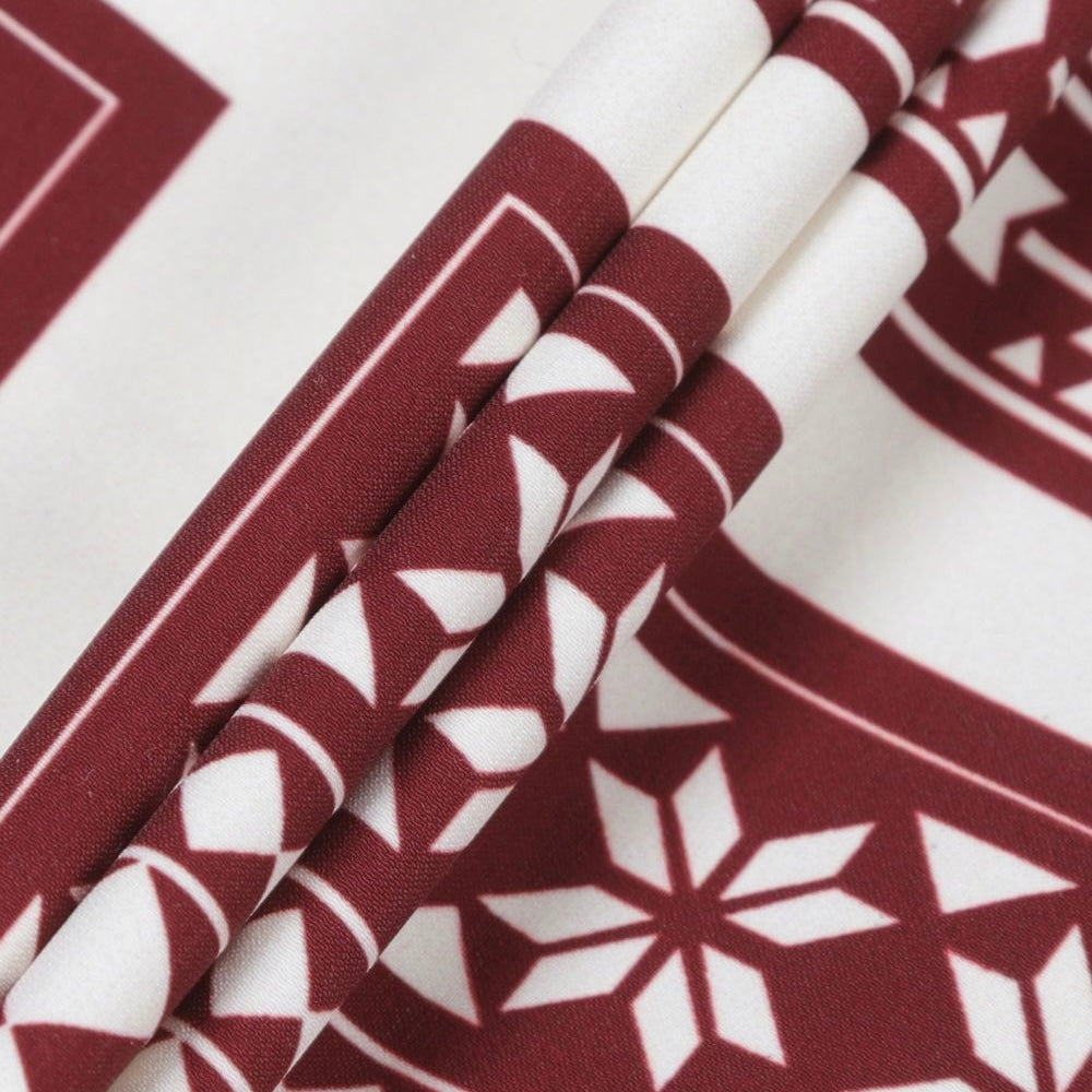 Rhude maroon and white swim shorts with a card print pattern and yellow drawstring, presented flat.