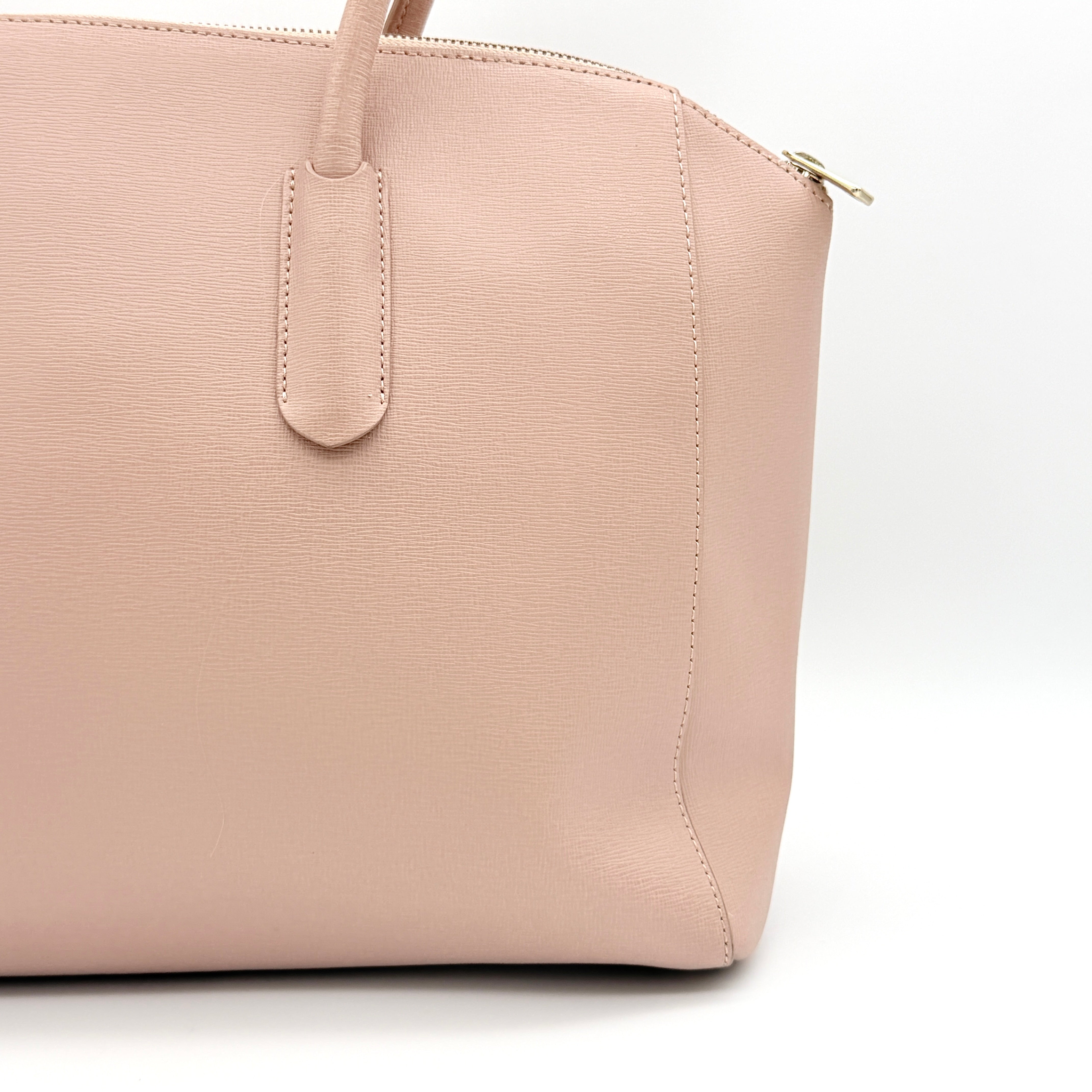 Furla Tessa handbag in light pink leather with gold hardware and double top handles.