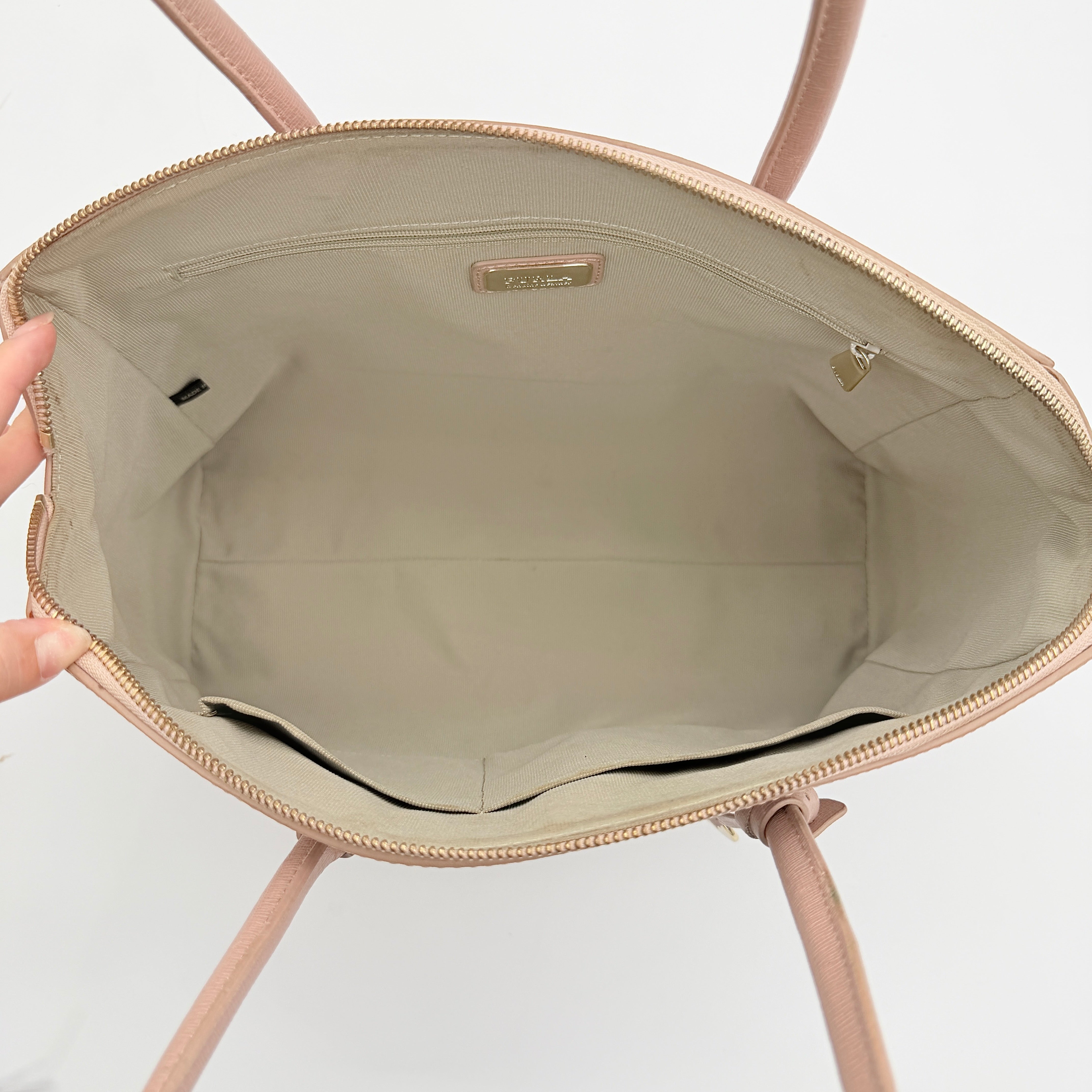 Furla Tessa handbag in light pink leather with gold hardware and double top handles.
