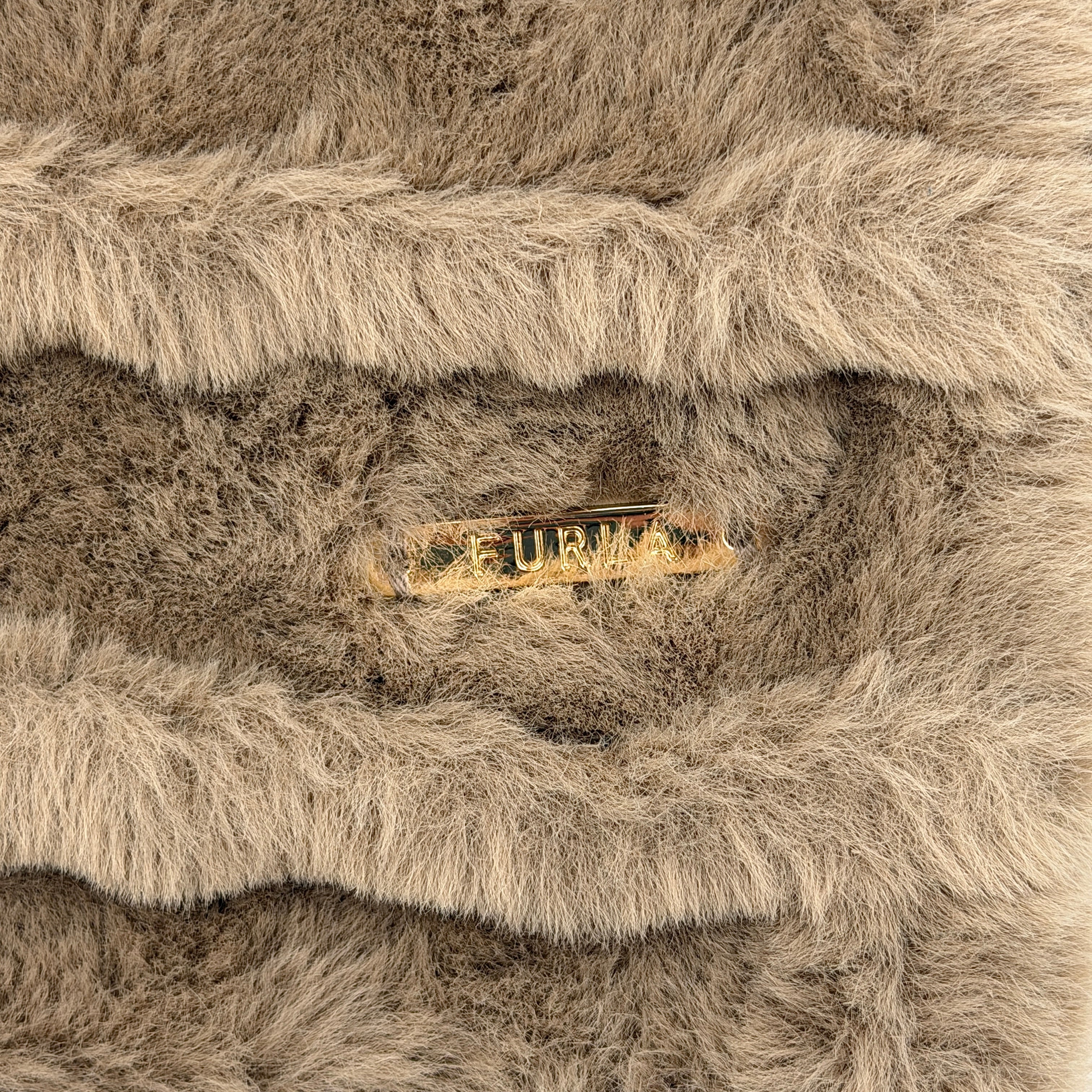 Furla brown faux fur scarf with sculpted ridge texture, gold logo plaque, and slit opening for effortless styling.