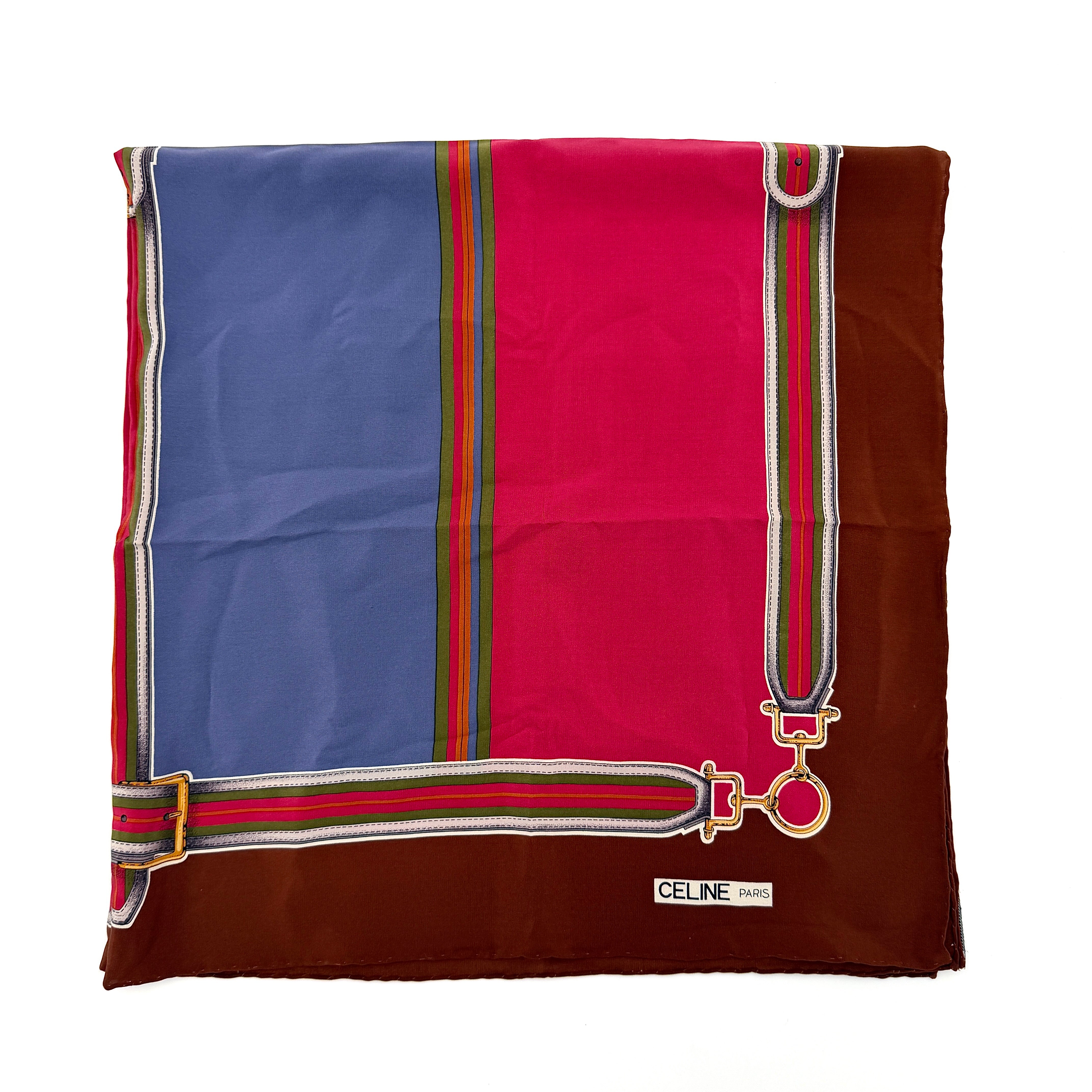 Celine silk scarf in raspberry pink, periwinkle blue, and brown with illustrated buckle and strap motifs.