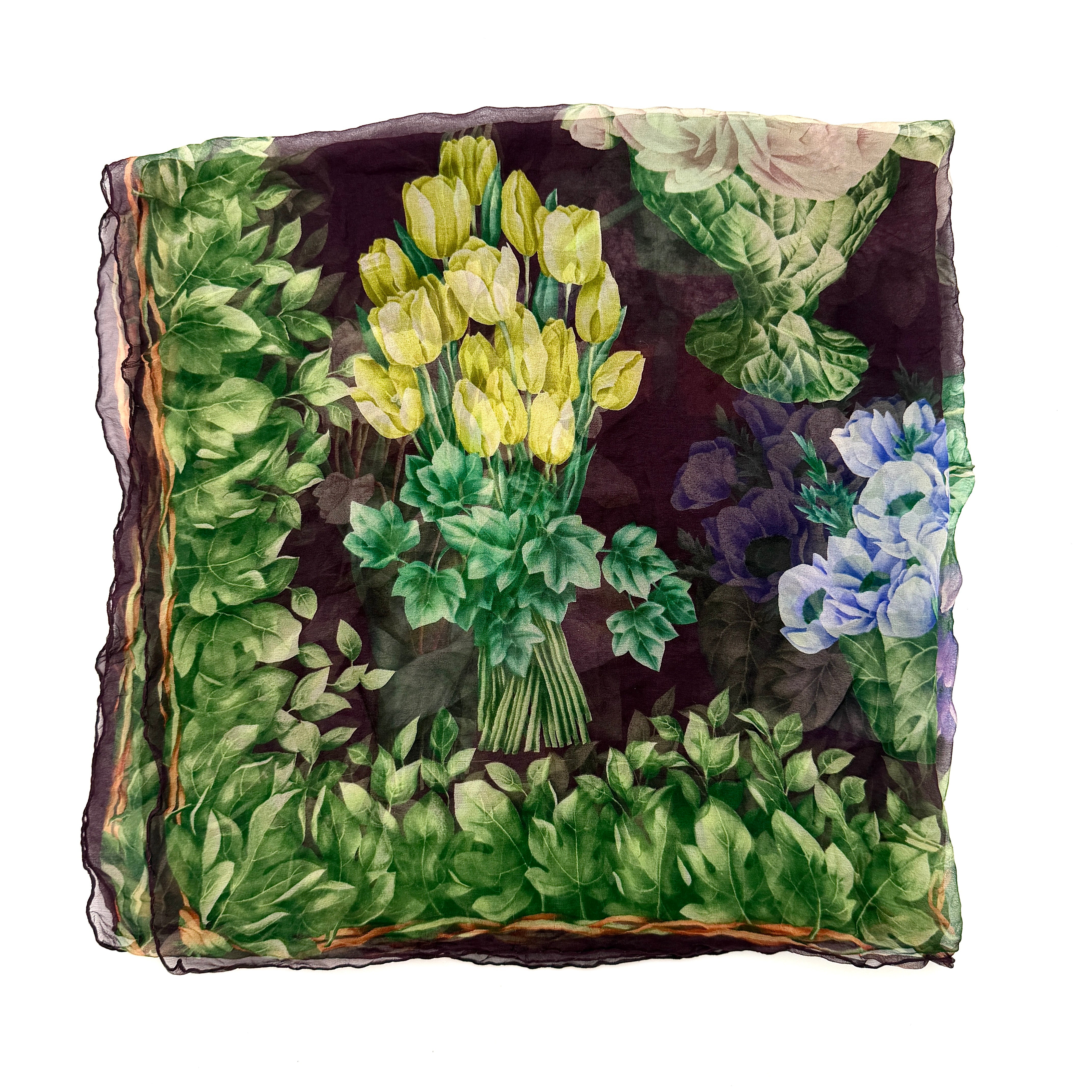 Gucci silk scarf adorned with artistic multicolour floral bouquets and leafy green border, elegantly draped to showcase its lightweight, sheer texture.