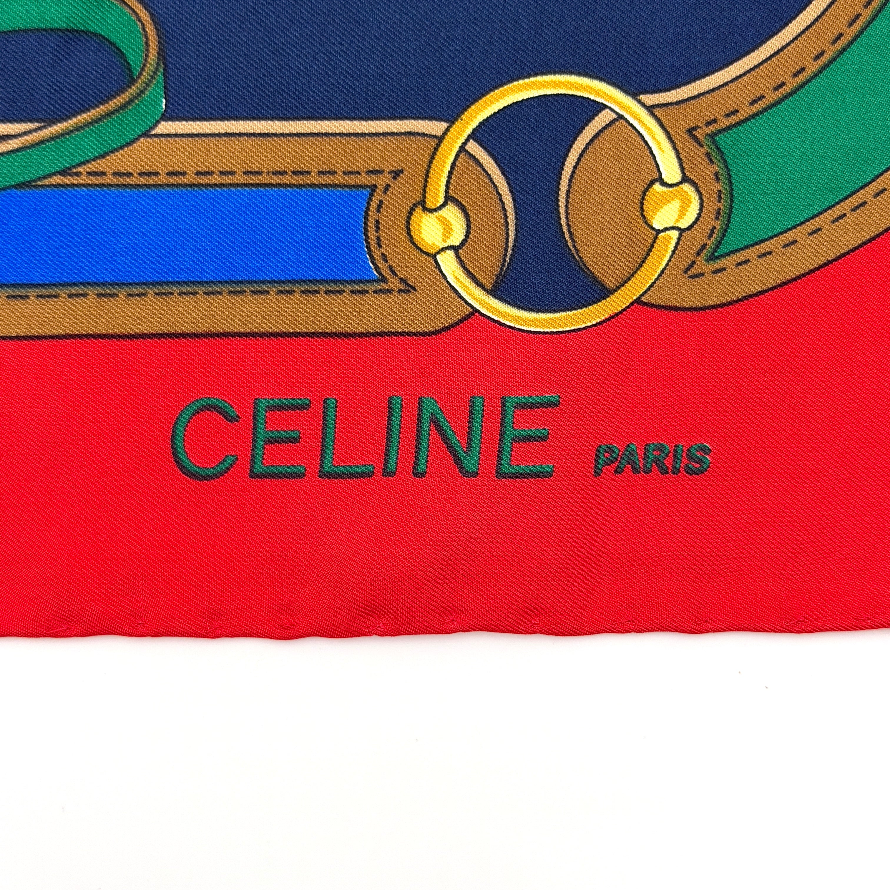 Celine silk scarf featuring a bold equestrian motif in navy, red, green, and gold.