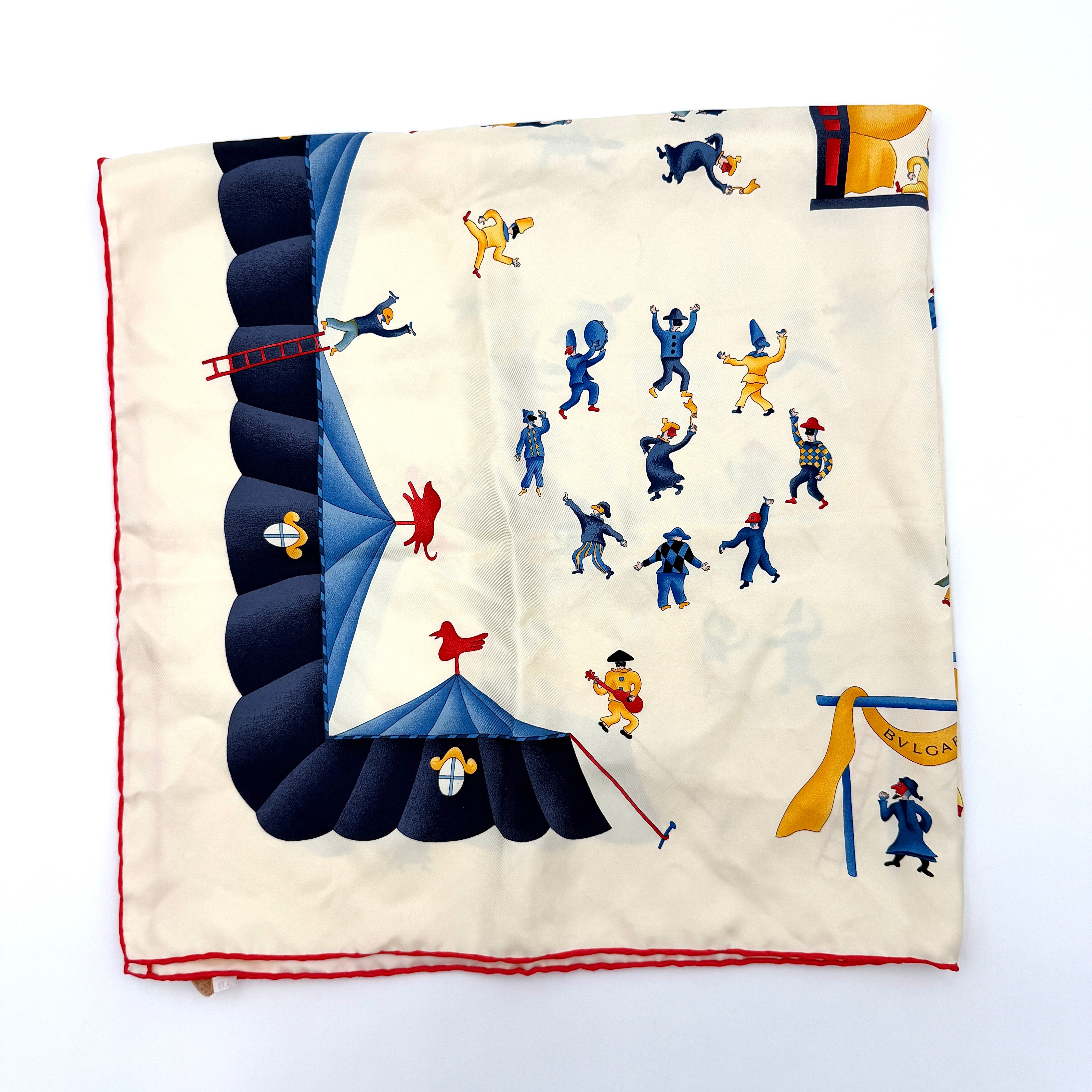 Bvlgari Girotondo di Marionette silk scarf featuring playful multicolour marionette illustrations and circus motifs on a creamy background.