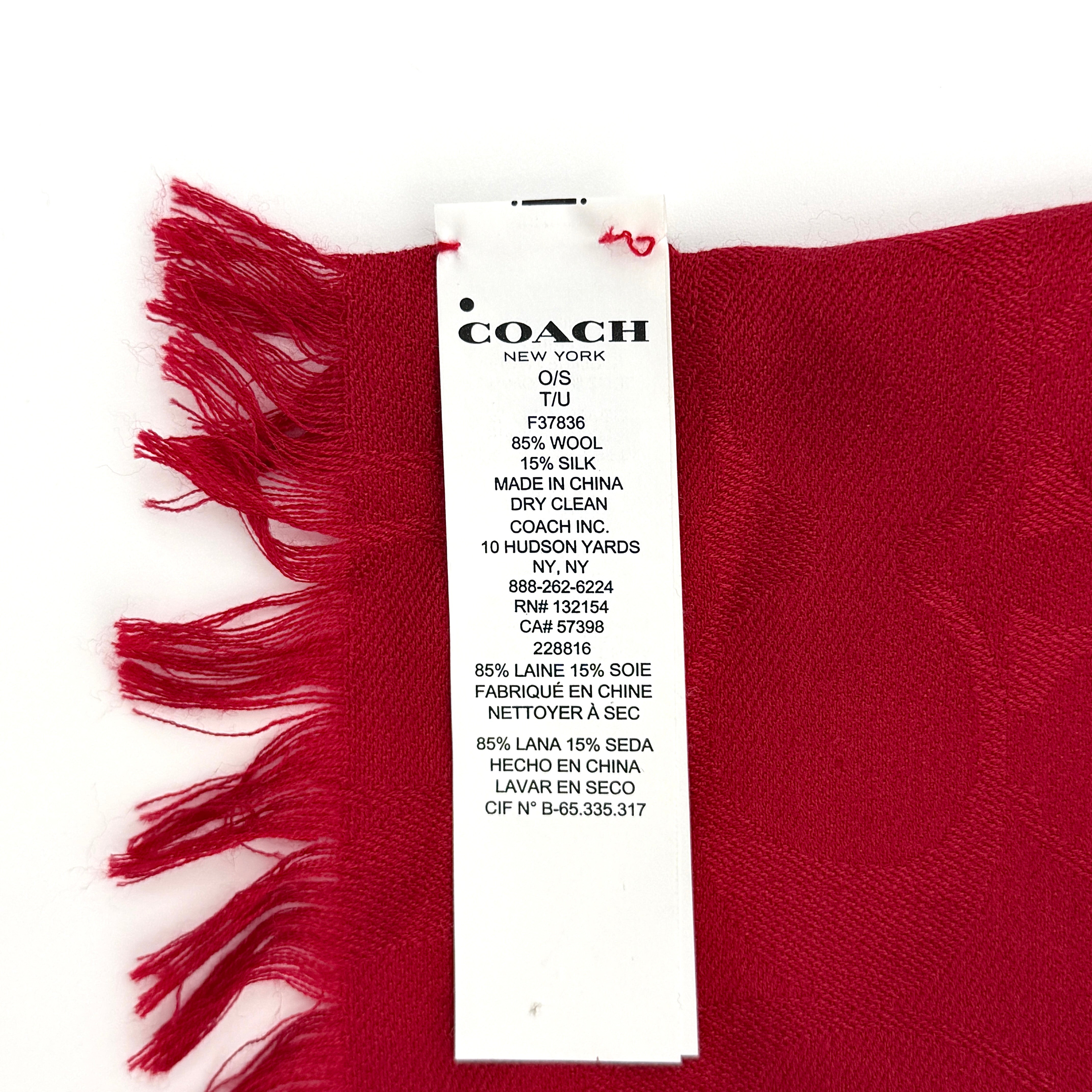 Coach Signature Monogram Wool Scarf in vibrant red wool and silk with tonal logo pattern and delicate fringe edging.
