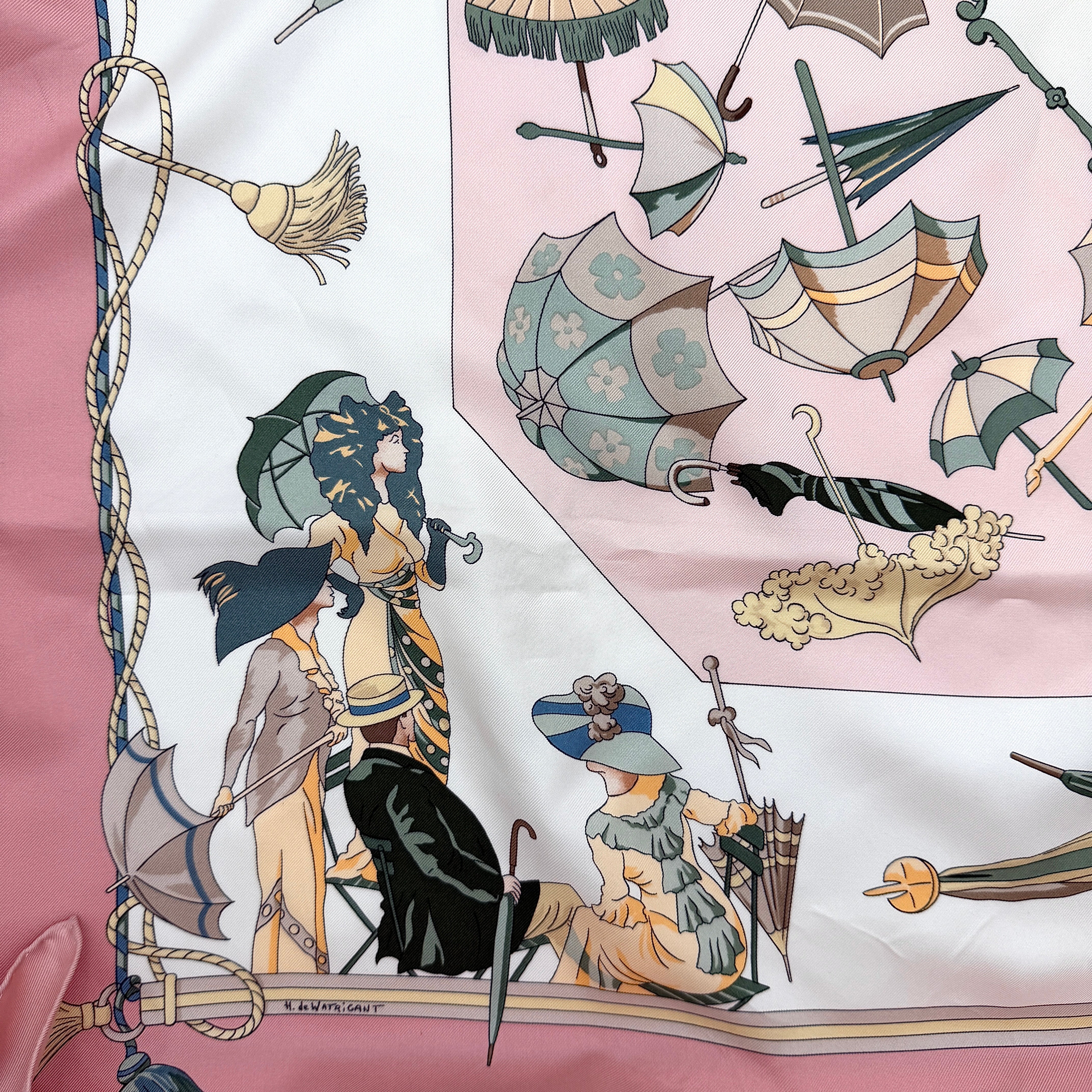 Hermès Ombrelles et Parapluies silk scarf in pink with umbrella print and illustrated figures, gracefully draped to show the intricate design.