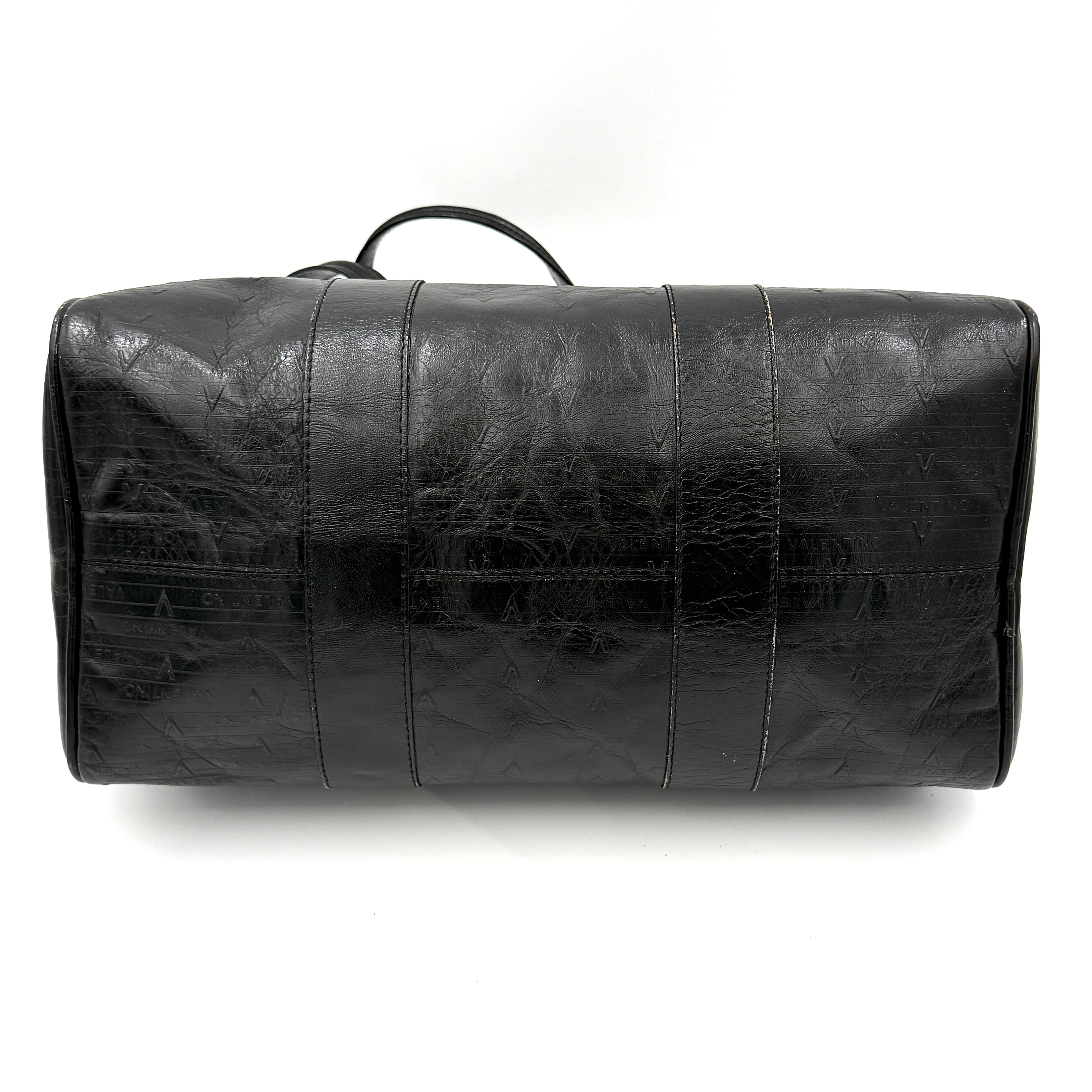 Valentino Monogram Boston Bag in black embossed leather with gold-tone V hardware and dual top handles.