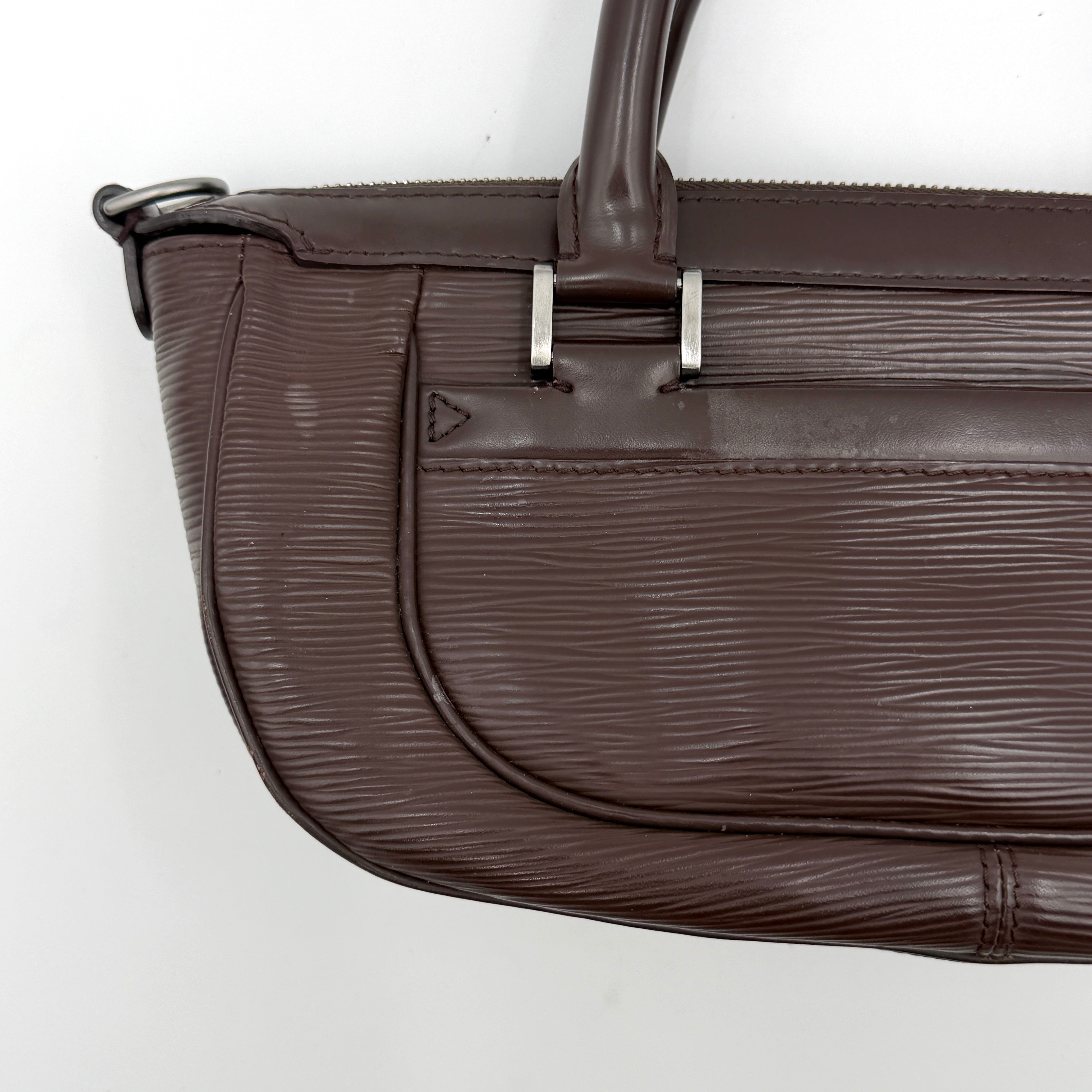 Louis Vuitton Dhanura PM 2Way shoulder bag in brown Epi leather with detachable strap and silver-tone hardware.