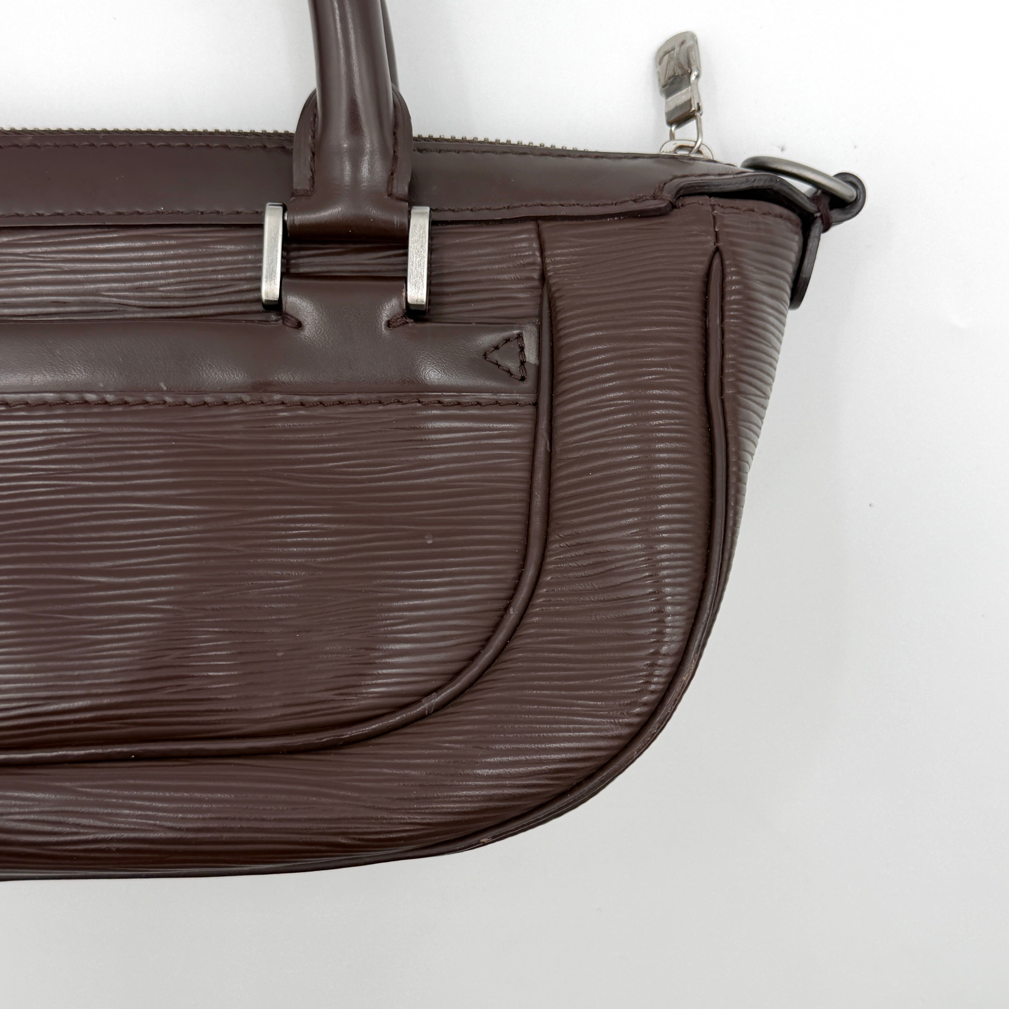 Louis Vuitton Dhanura PM 2Way shoulder bag in brown Epi leather with detachable strap and silver-tone hardware.