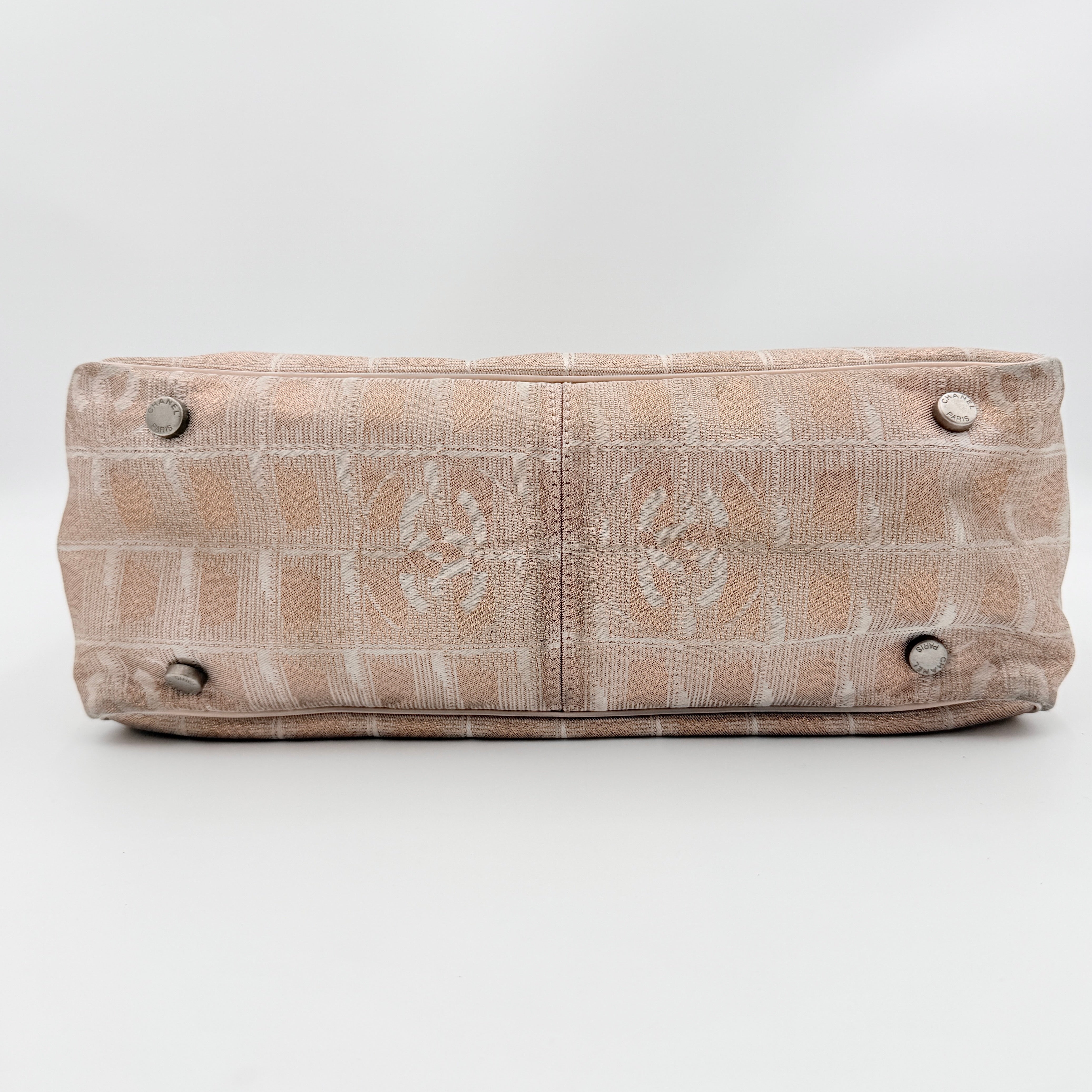 Chanel New Travel Line Tote Bag in rose gold jacquard with blush leather handles, displayed against a white background.