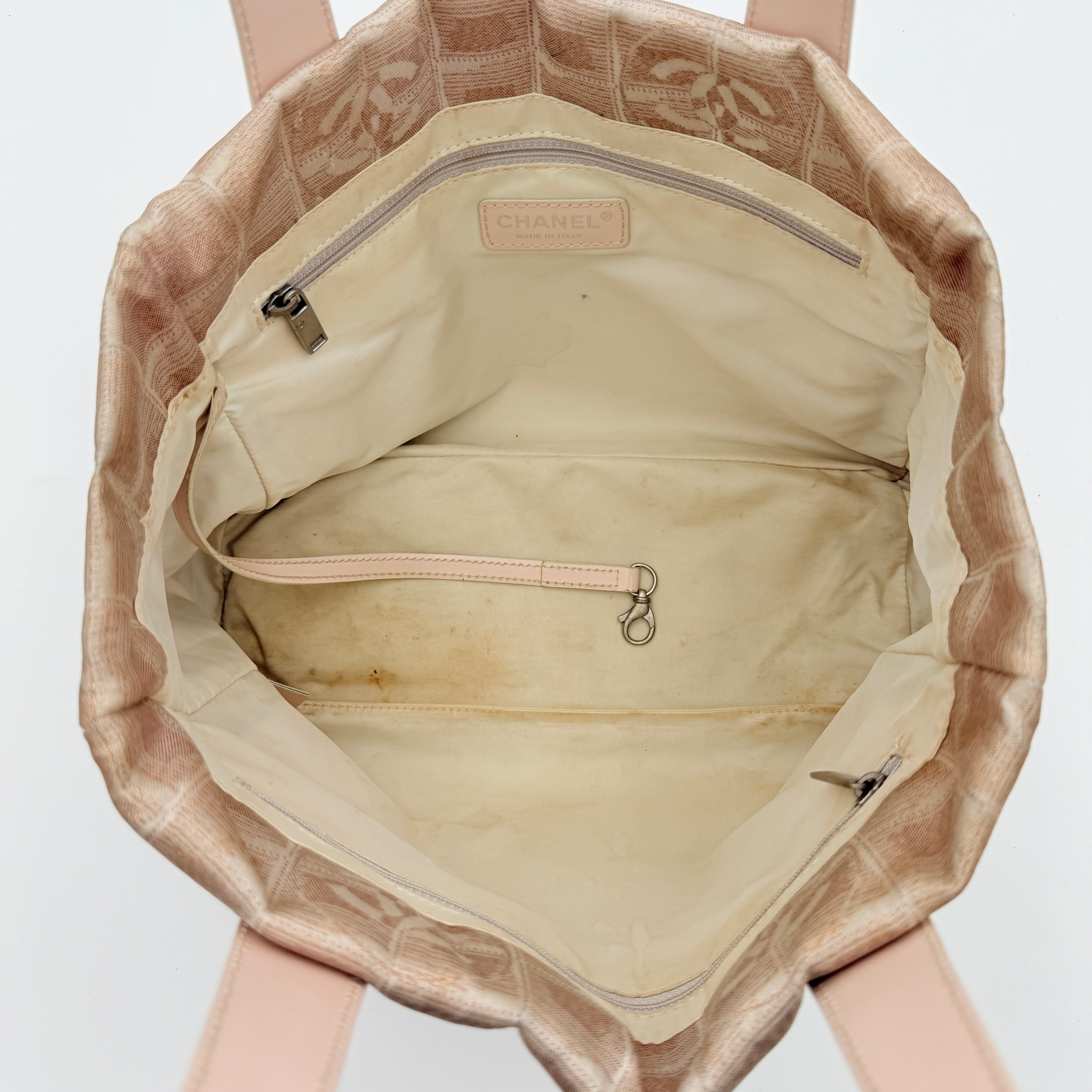 Chanel New Travel Line Tote Bag in rose gold jacquard with blush leather handles, displayed against a white background.