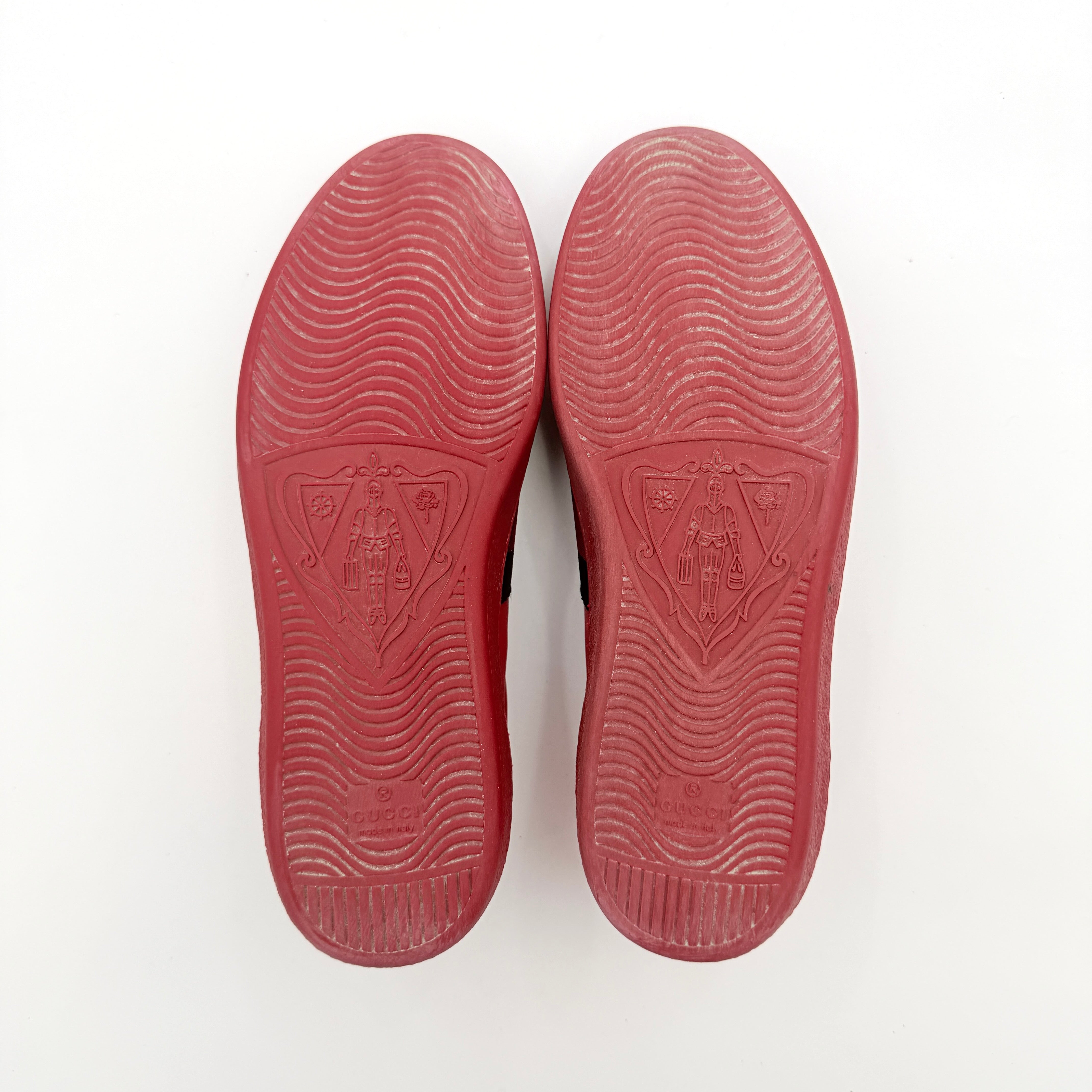 Gucci Ace Embroidered Bee sneakers in red leather with navy and red stripes and gold bee detail.