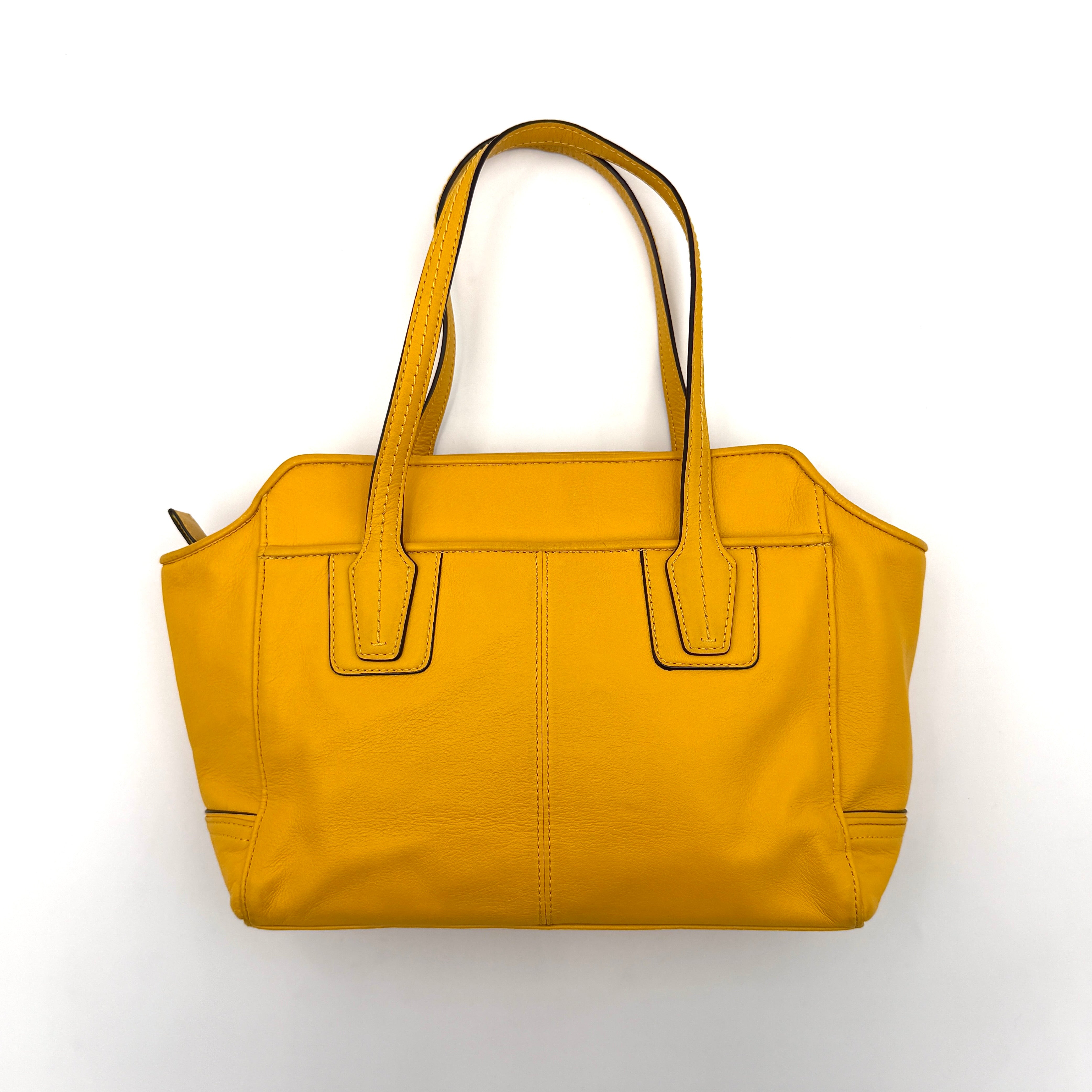 Coach Taylor Bette Mini Tote Bag in vibrant yellow leather with double top handles and detachable shoulder strap displayed beside it.