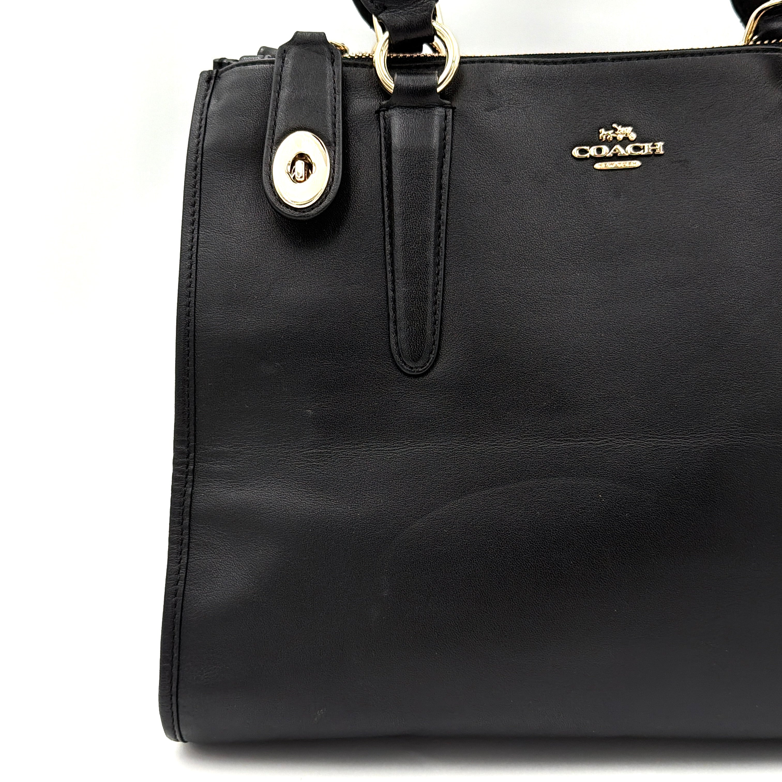 Coach Crosby Carryall Handbag in smooth black leather with gold-tone hardware and a structured silhouette.