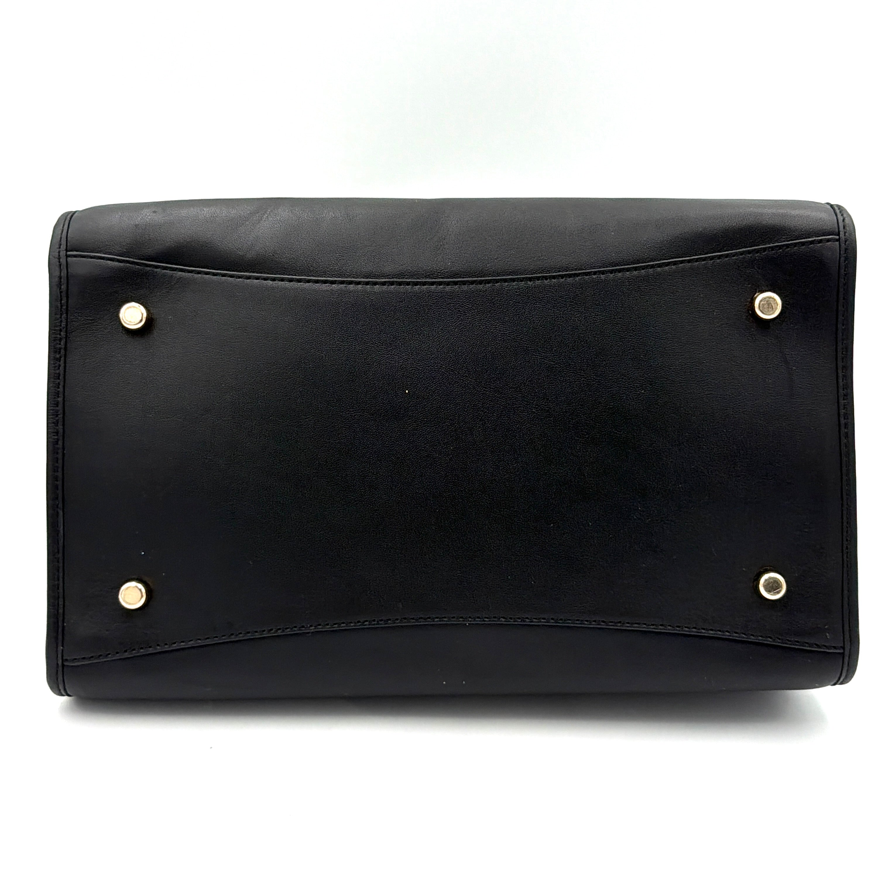 Coach Crosby Carryall Handbag in smooth black leather with gold-tone hardware and a structured silhouette.